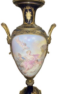 Pair of 19th Century French Sèvres Porcelain Urns with Ormolu Mounts