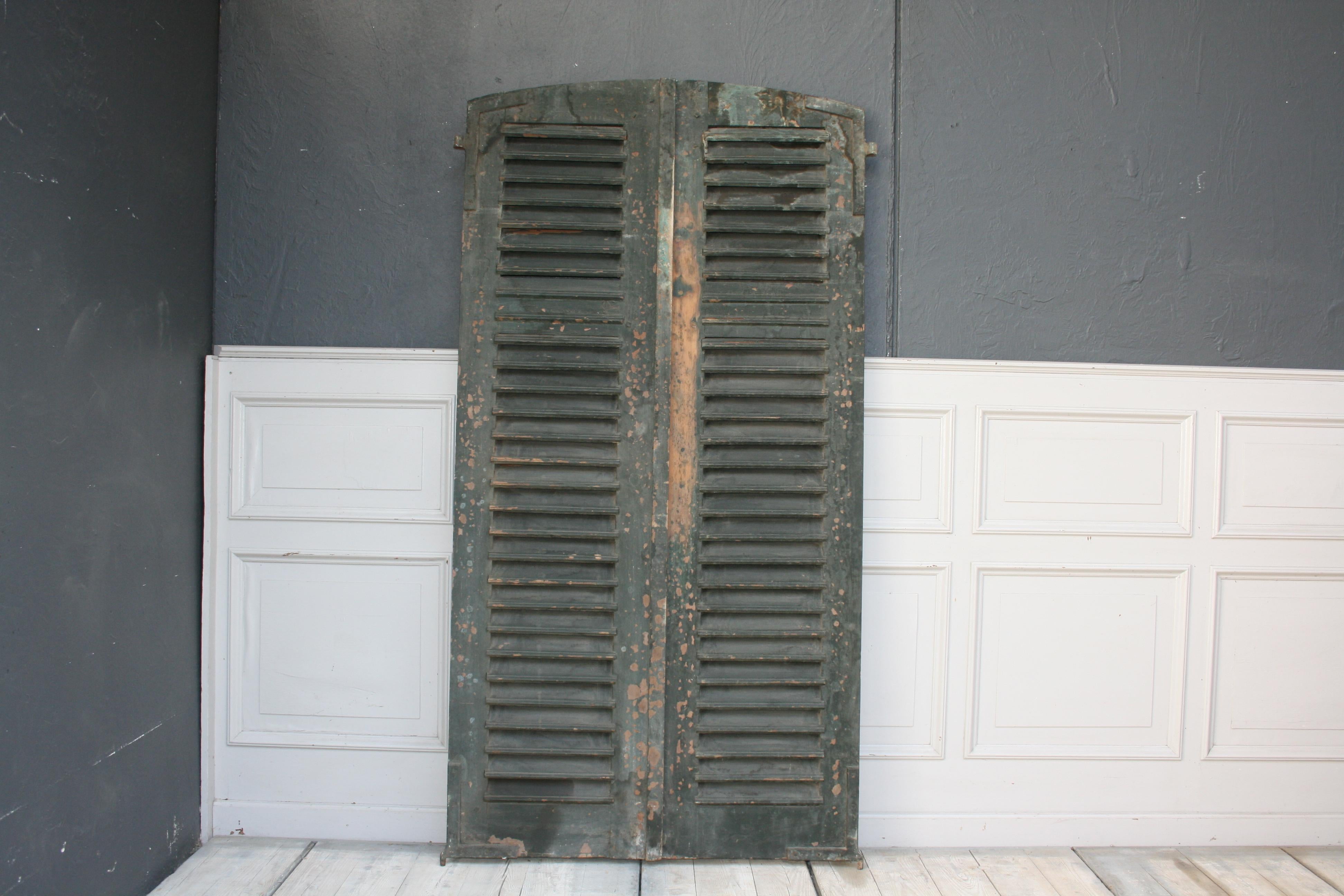 Pair of eyebrow shape shutters from France, circa late 19th century. The shutters still have the original color and thus a wonderful weathered patina.
Dimensions:
195 cm high / 76.77 inch high,
100 cm wide / 39.37 inch wide,
4 cm deep / 1.57