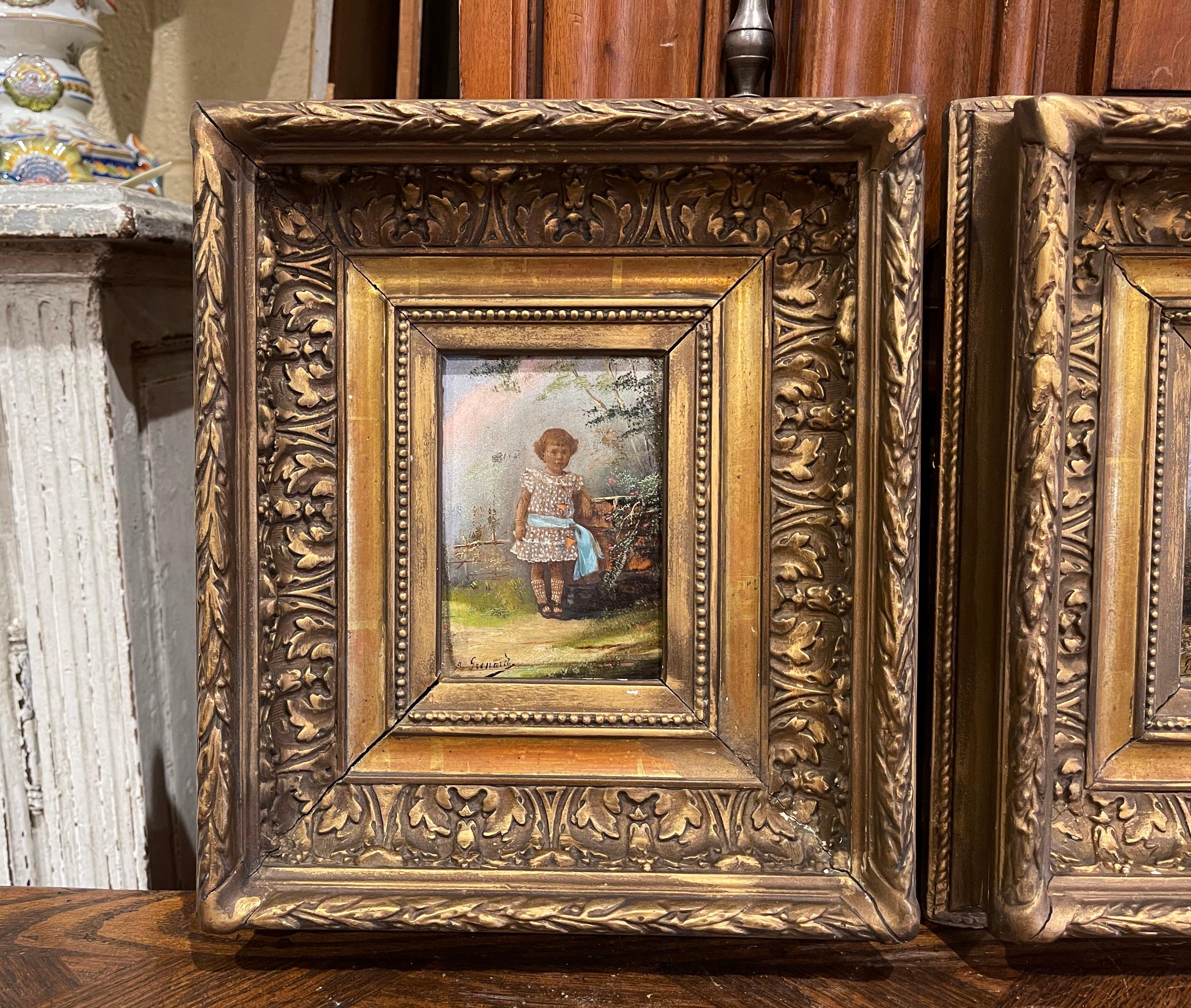 These charming antique paintings were created in France, circa 1870. Set in the original carved gilt frames, each artwork is painted on board and signed by the artist A. Grenard in the lower left corner. Each composition depicts two children in 19th