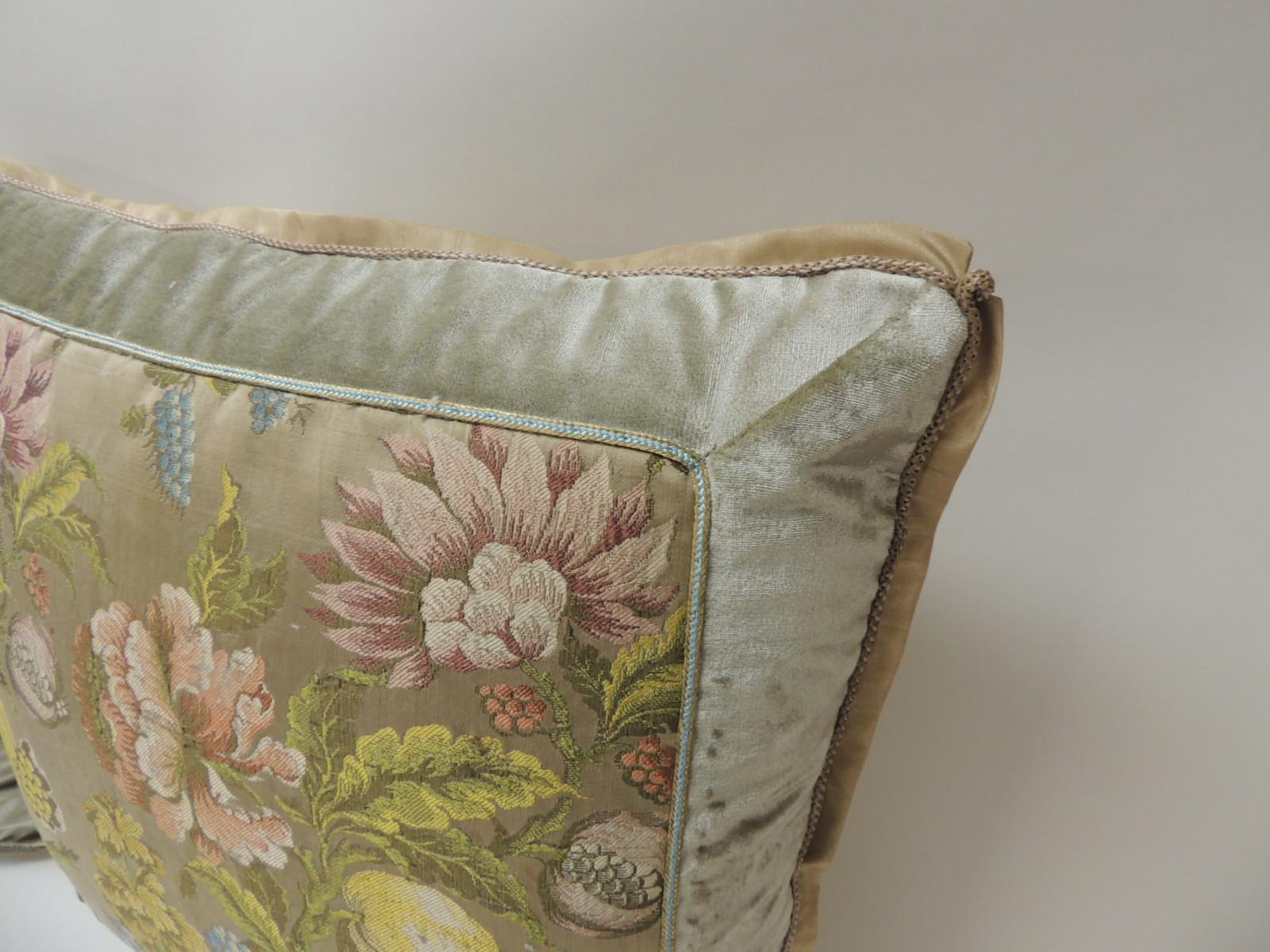 Pair of 19th century French brocade floral decorative pillows
Pair of yellow and green floral square antique textile decorative pillows. Colorful French woven silk brocade pillows, framed with silk velvet and embellished with a small silk blue and