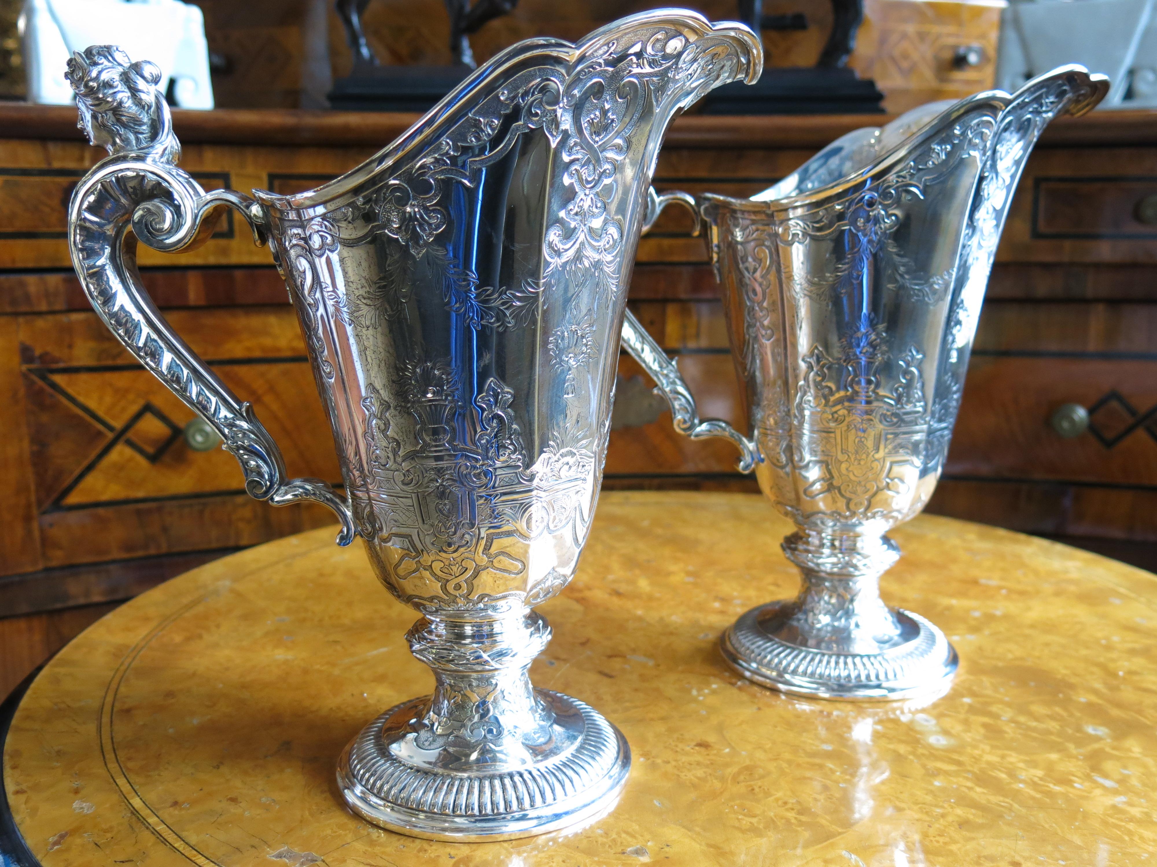 
Introducing a delightful pair of 19th-century French silver water jars, a testament to the exquisite craftsmanship and elegance of the era. These stunning pieces boast intricate silverwork, showcasing the mastery of French artisans in the 1800s.