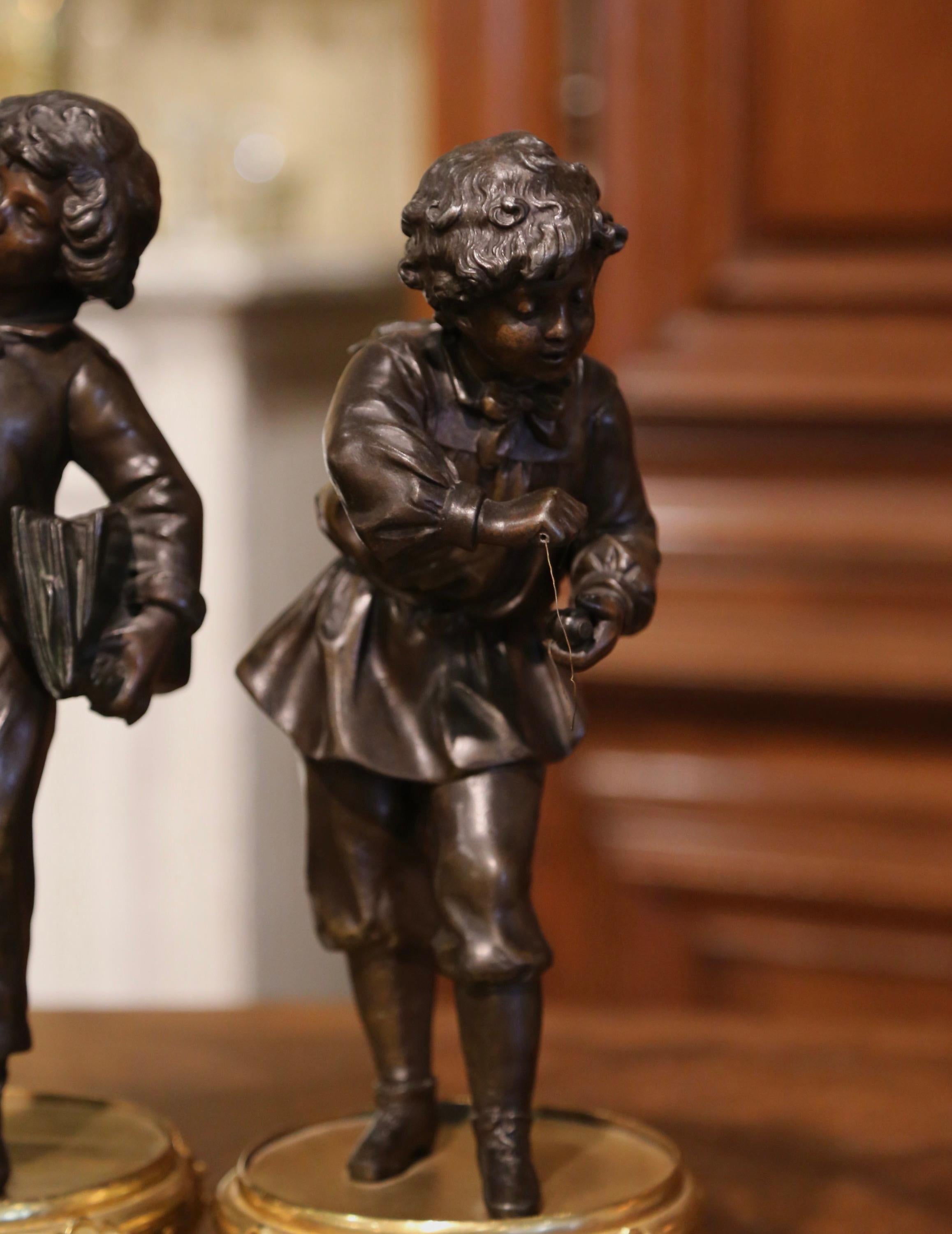Hand-Crafted Pair of 19th Century French Spelter and Bronze Boy Figurative Sculptures For Sale