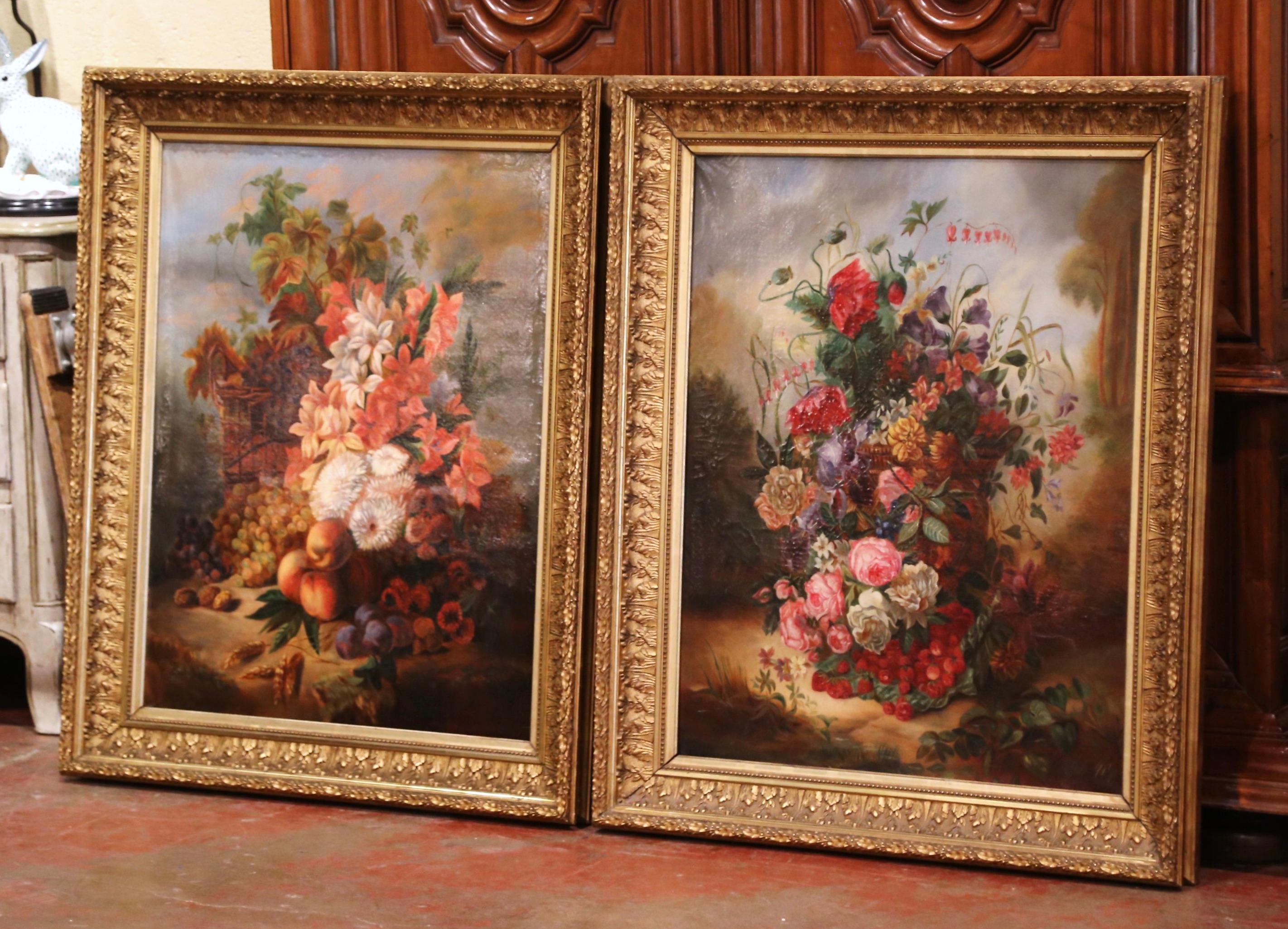 Invite color into your home with this large pair of antique, floral paintings. The artworks were crafted in France circa 1870, and are set in carved gilt frames. Each canvas features an elegant bouquet of flowers. The paintings are in excellent