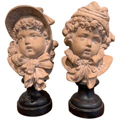 Coppia di busti di bambini in terracotta francese del XIX secolo firmati E. Guillemin