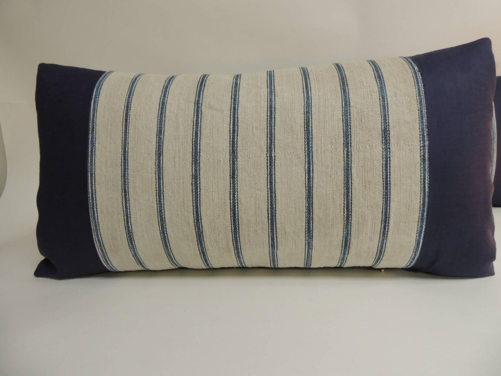 Pair of French Grain Sack ticking stripes textile on natural and blue long bolster decorative pillows
framed and backing with navy blue linen. Accent bolster pillow handcrafted and designed in the USA. Throw pillow with custom-made pillow inserts