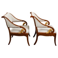 Pair of 19th Century French Walnut Armchairs with Carved Gilt Mythical Animals