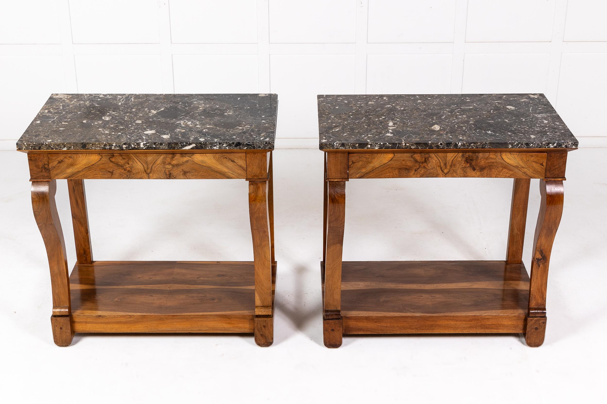 A Pair of 19th Century French Walnut Console Tables with Original Marble Tops.

The tables executed in highly figured walnut with sap wood veneers chosen for the bases to bring out the pattern in the timber. The original marble tops of lovely figure