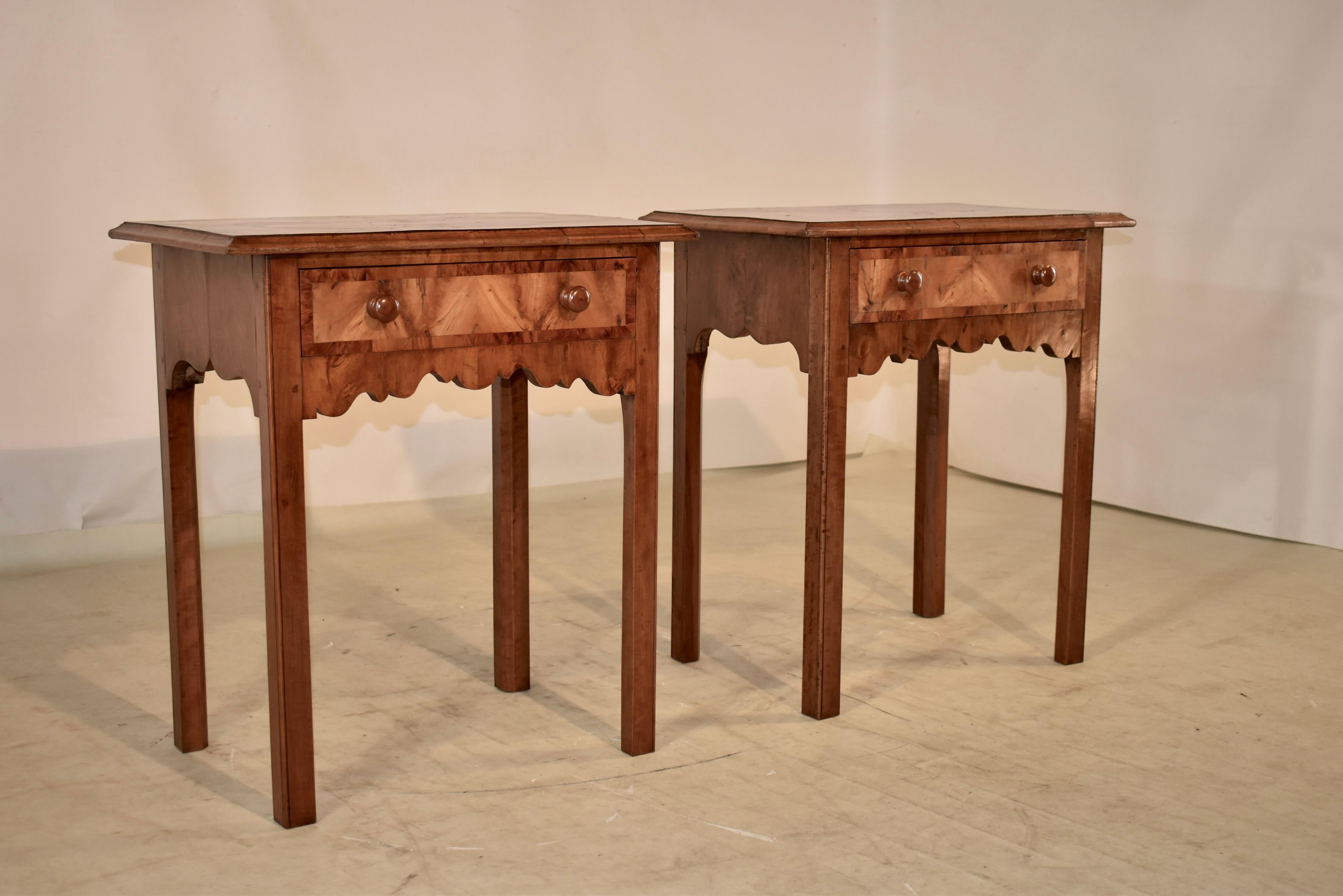 Pair of 19th century walnut side tables from France. The tops feature book matched walnut of wonderful quality and graining, and have an inner oval band, and and outer banding which really set off the design of the top of the tables. The tops have