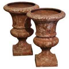 Pair of 19th Century French Weathered Iron Campana Form Garden Urns