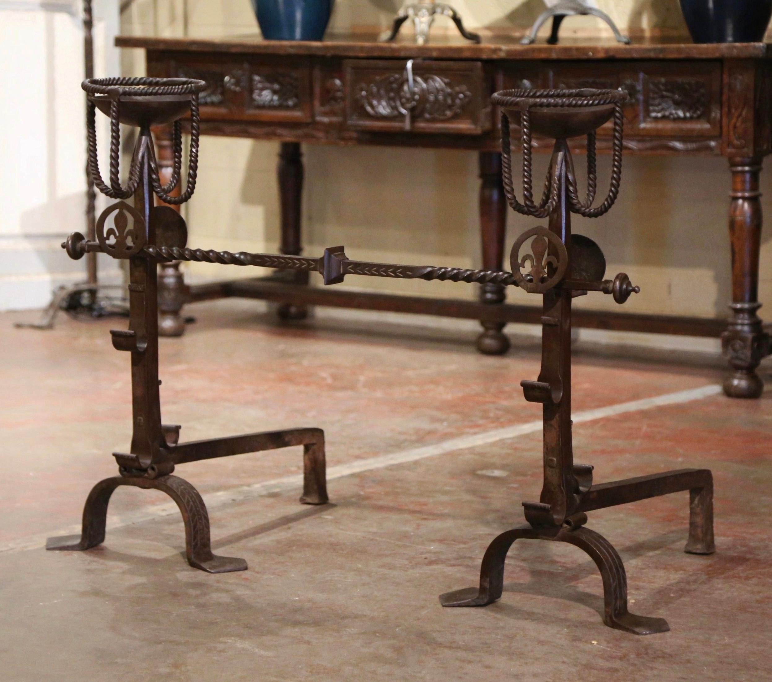 Patinated Pair of 19th Century French Wrought Iron “Landiers” Andirons with Fleur de Lys For Sale