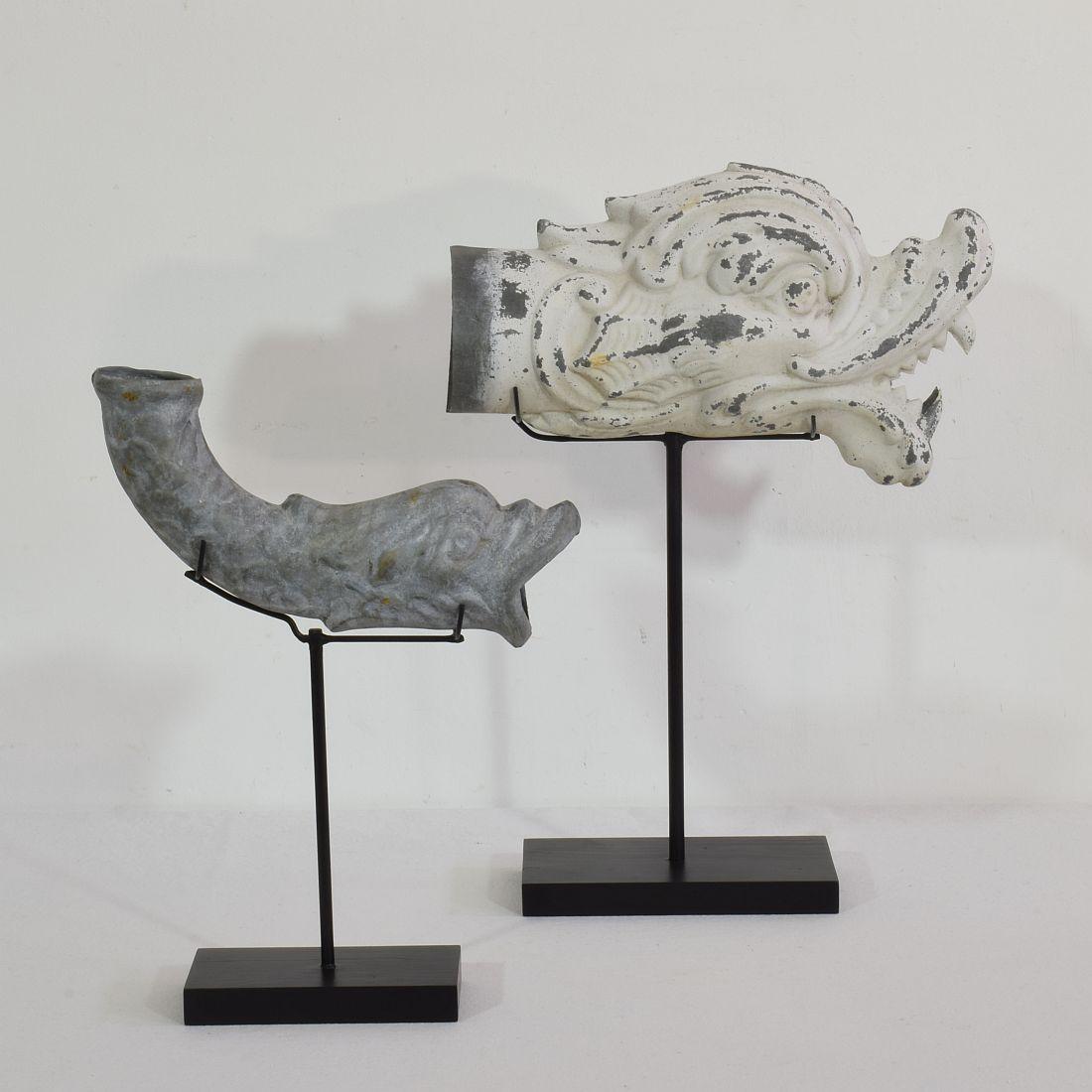 Rare pair of zinc fragments representing mythical figures/ gargoyles. They once graced a rich facade of a building,
Original period pieces, France, circa 1850-1900.
Weathered. Measures: H 30-38cm, W 22-27cm, D 6.5-10cm
Measurement includes the