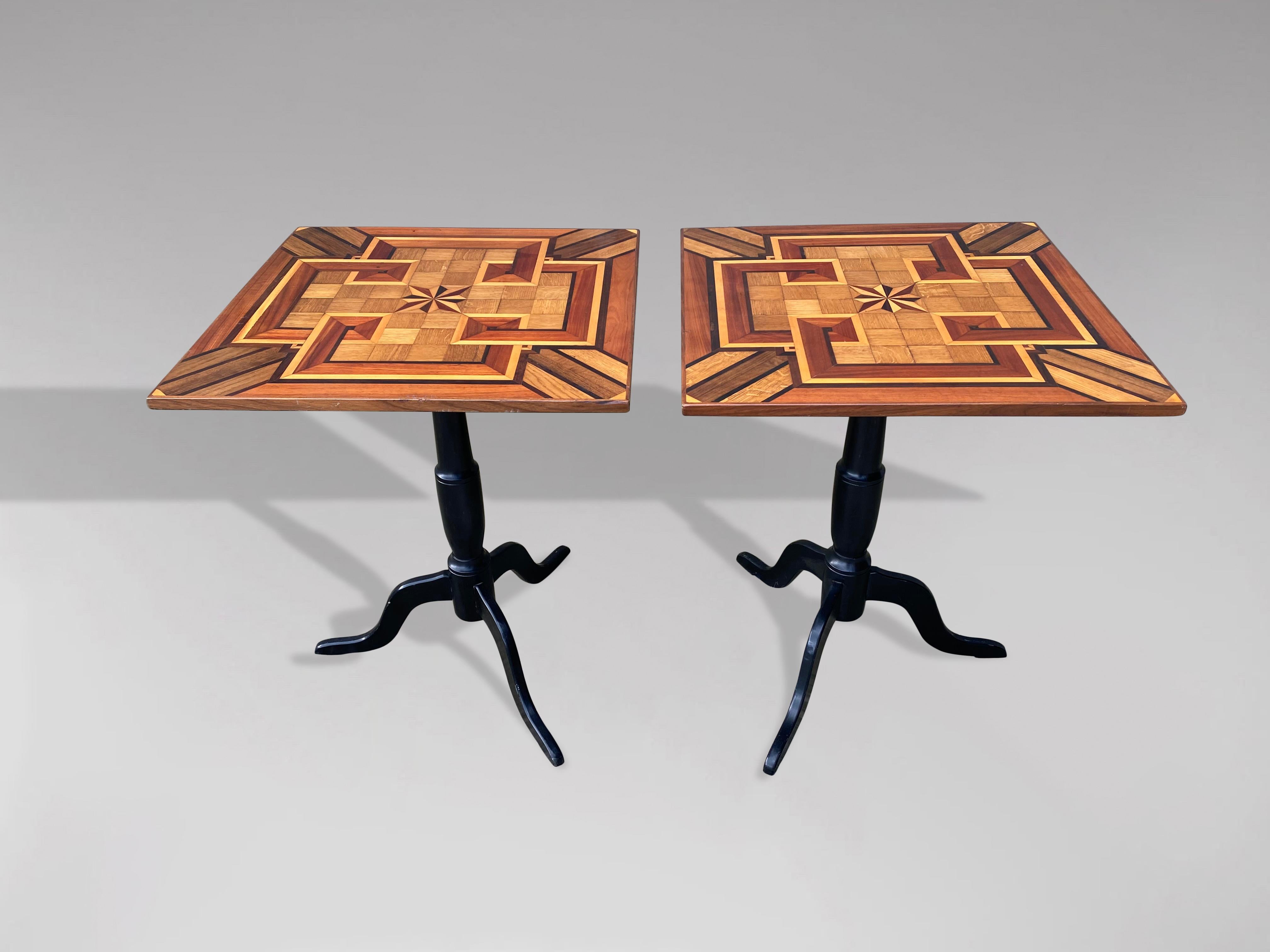 A fine pair of 19th century geometric parquetry inlay and marquetry square top occasional tables standing on the original black painted tripod base. Amazing quality!

The dimensions are:
Height: 75cm (29.5in)
Width: 61cm (24.0in)
Depth: 61cm (24.0in)