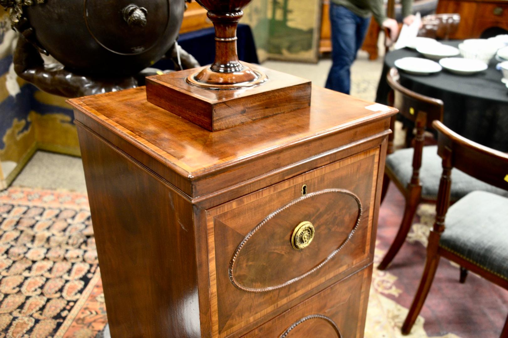 Pair of George IV mahogany humidor cabinets mounted with urn form knife boxes, interior with lead lined drawers, two metal shelves in one, height 71 inches, width 19 inches.