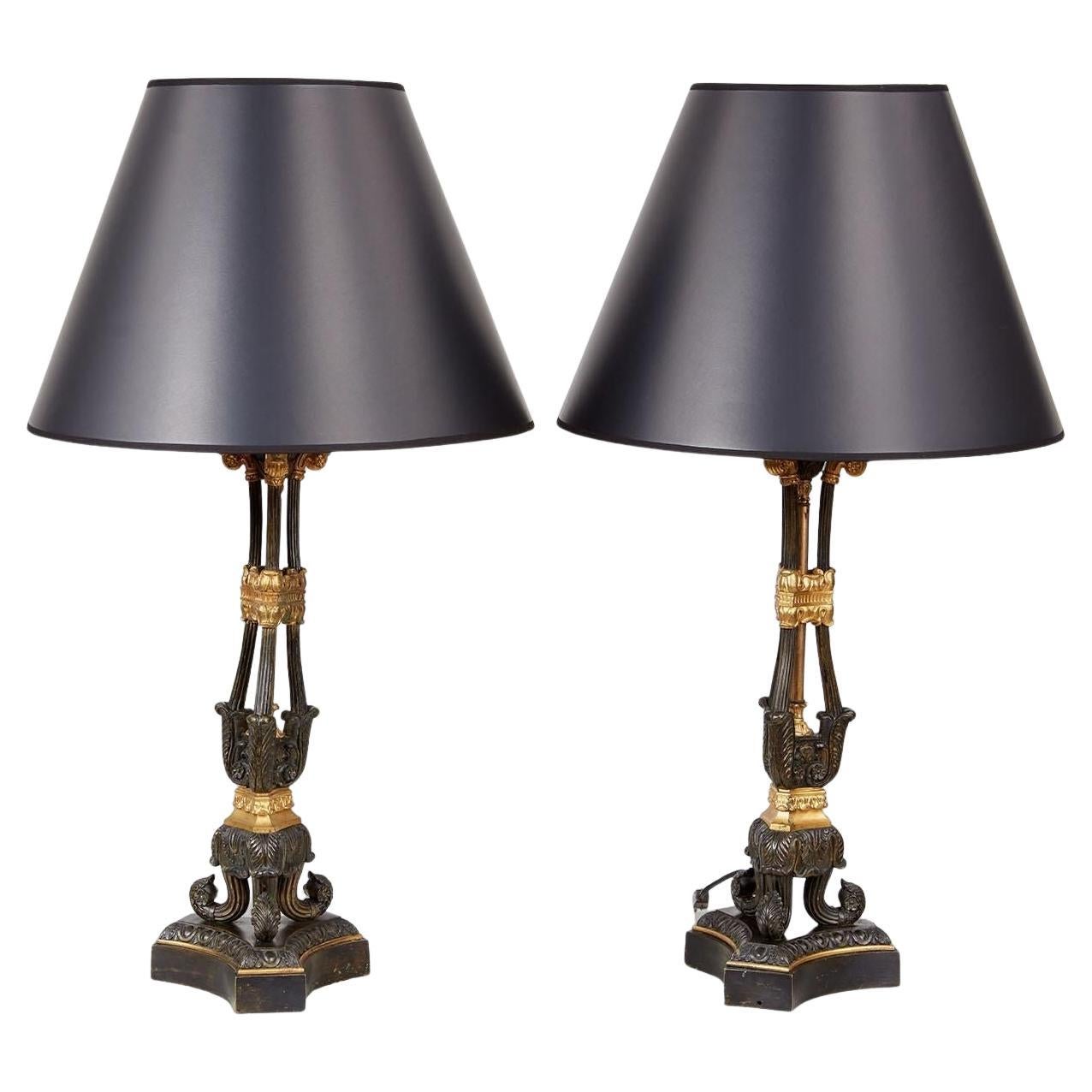 Paire de lampes en bronze patiné et doré du 19e siècle
