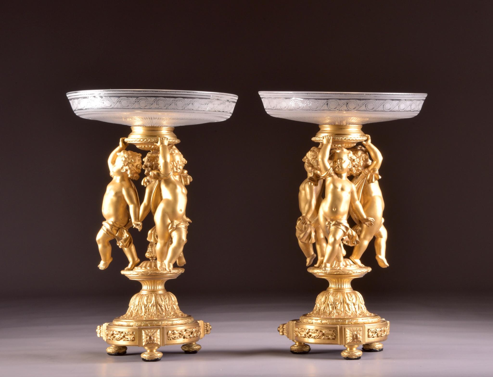 An Exceptional pair of 19th century Napoleon III gilt bronze and crystal, 9 light candelabra. This special set has two functions and can be used as a candlestick as well as a beautiful centerpiece / milieu de table.
Each candlestick is richly