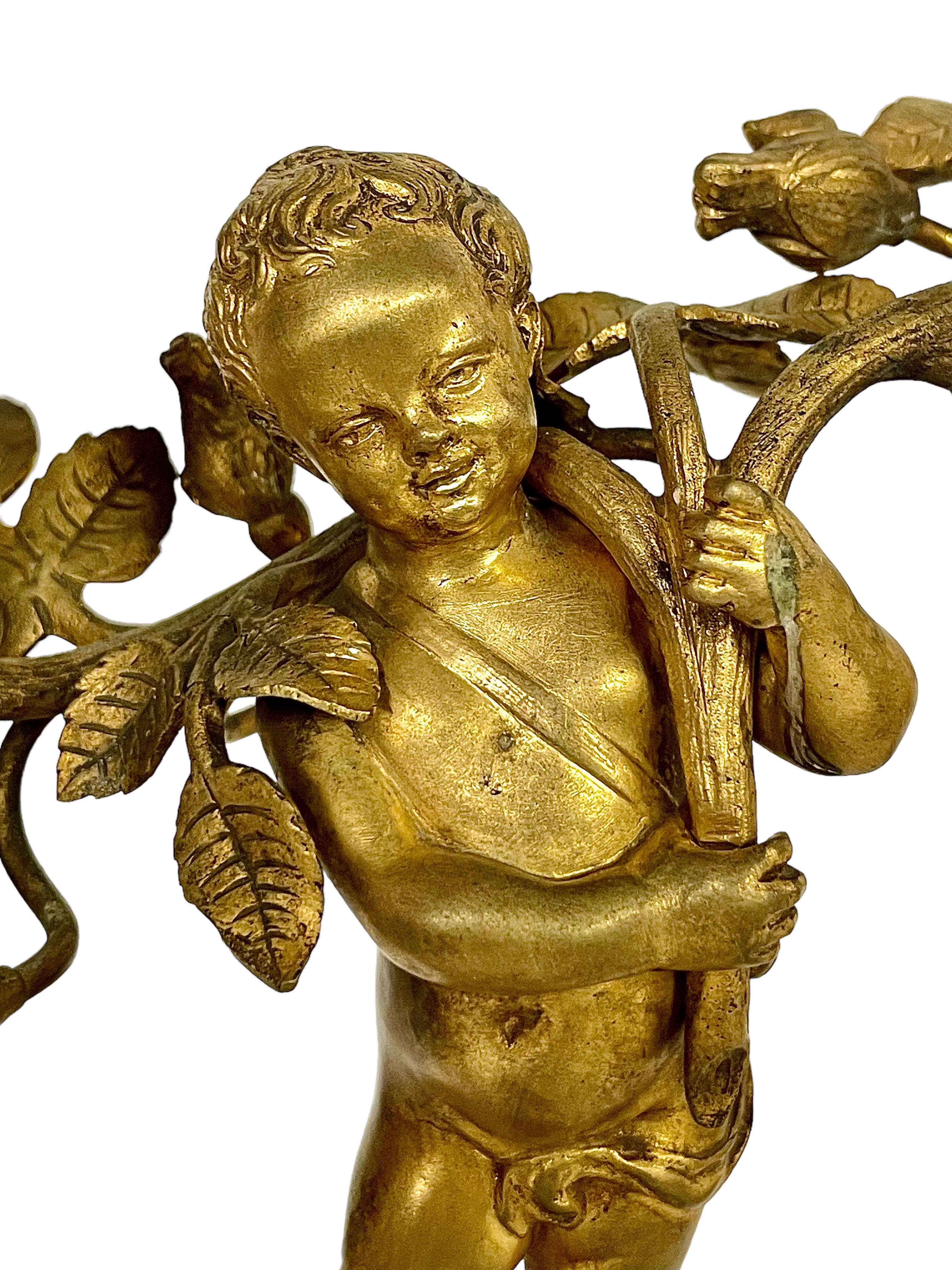 French 19th Century Pair of Gilt Bronze Cherubs Candelabra on White Marble Stands For Sale