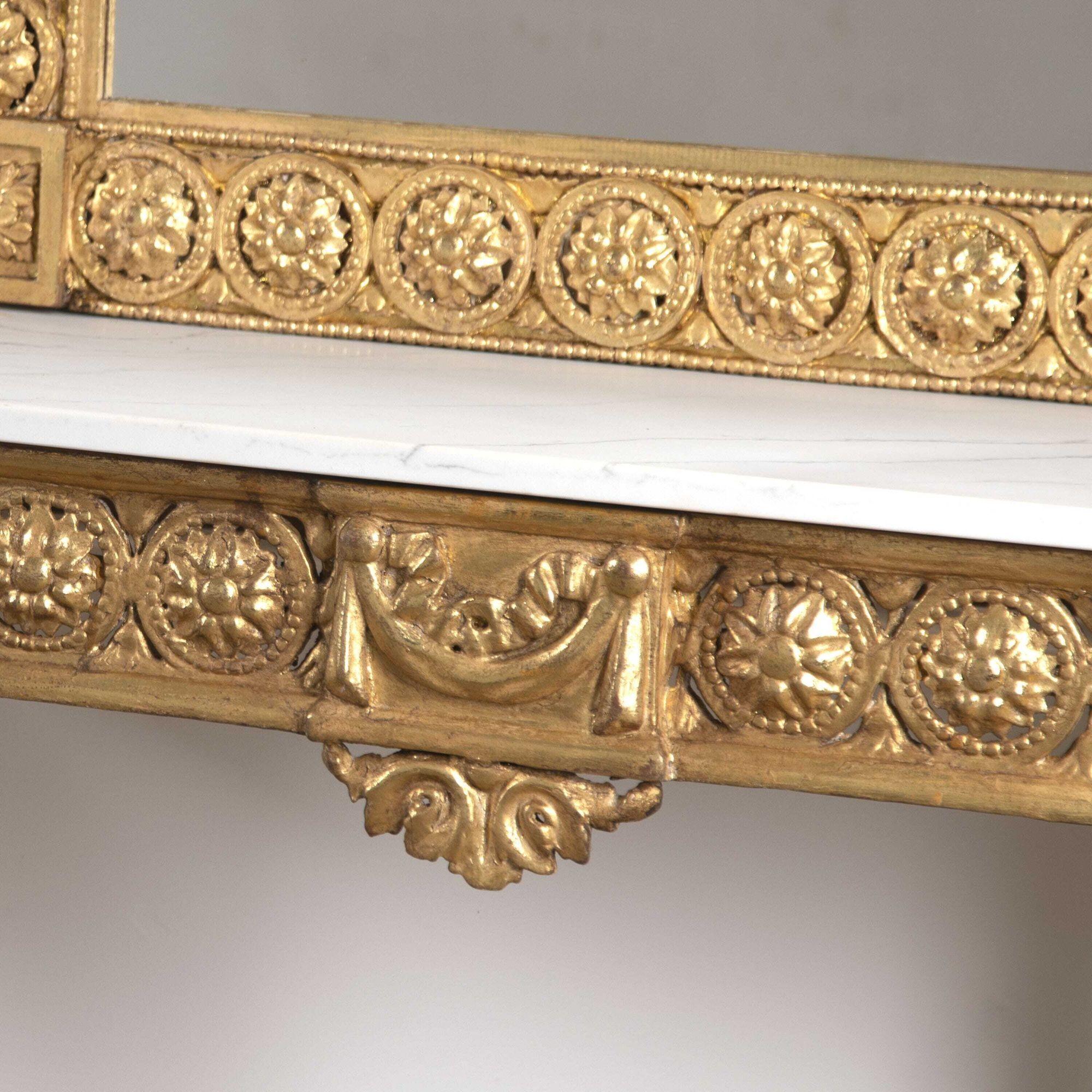 Fantastic pair of 19th Century gilt console tables with gilt mirrors of impressive form and size.
These decorative pieces have been brought back to life after the console tables were found in a poor condition with their marble tops broken. Both