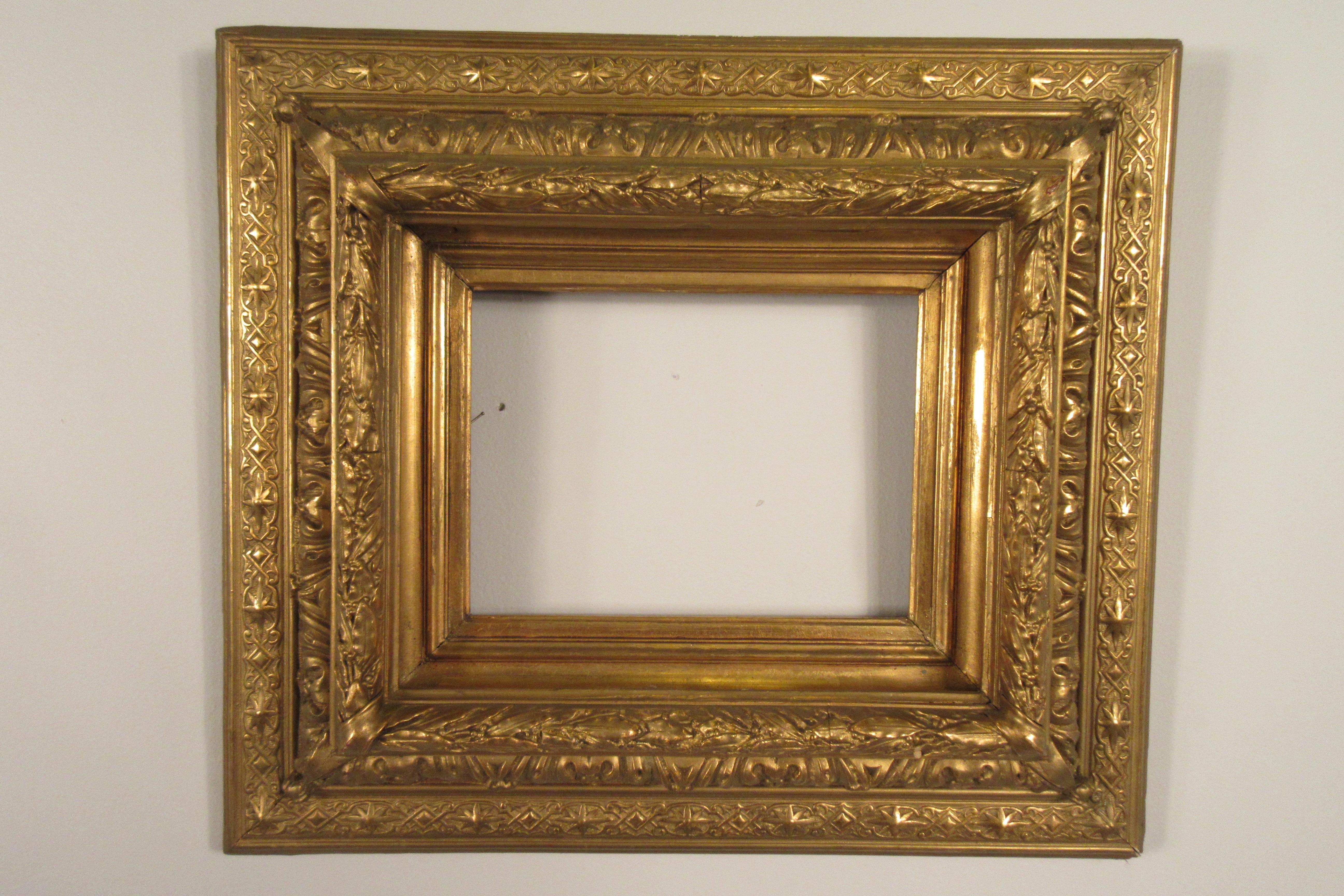 Pair of 19th century gilt gesso frames. 3 pieces of gesso are missing off the frame. 
I recently found one  large piece of gesso molding that needs to be put back onto the frame. There is no picture yet of the frame with this piece reattached.
