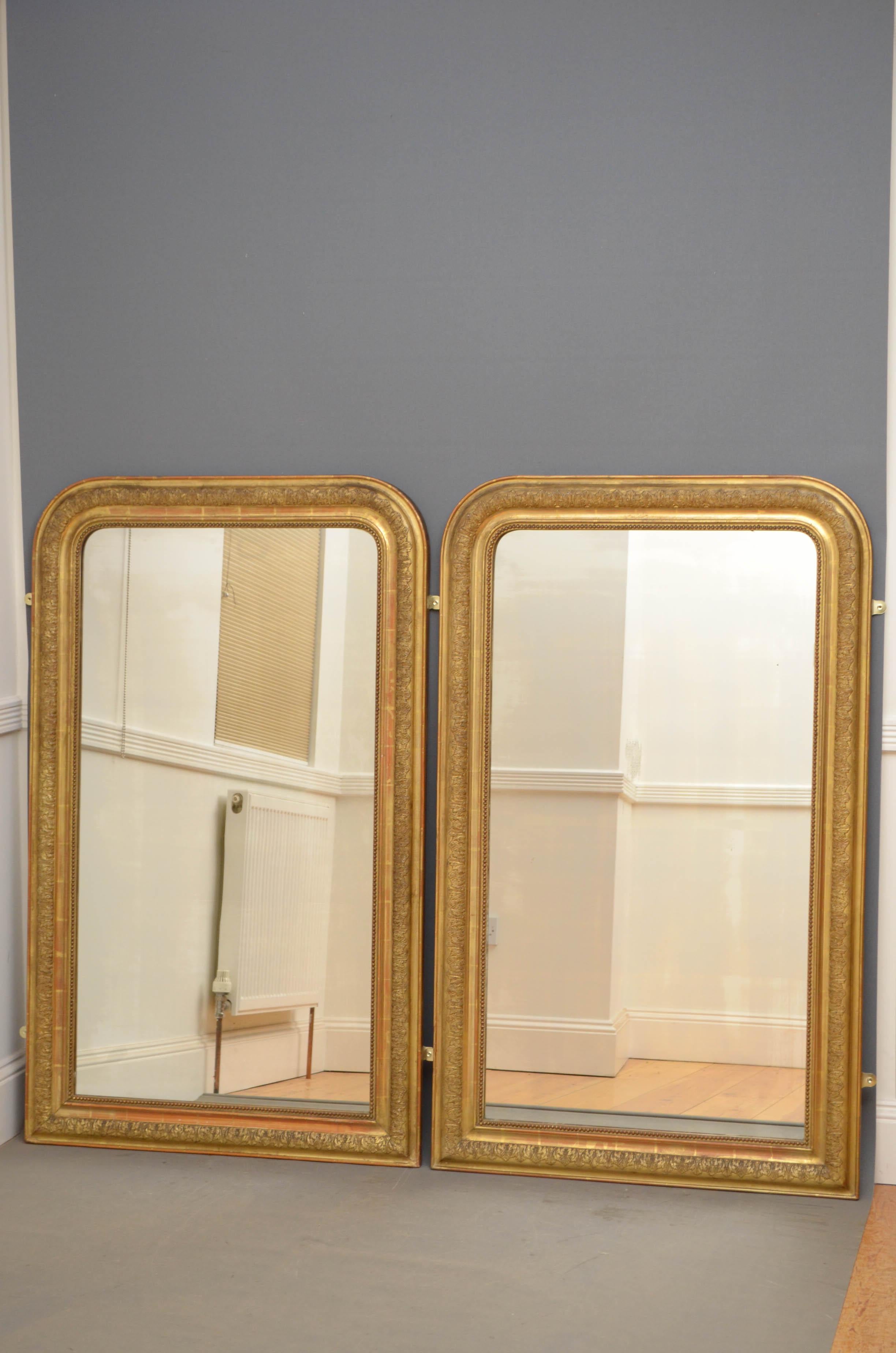 Sn4758 pair of French gilded wall mirrors, each having original glass with some foxing in moulded and carved giltwood frame. This pair of mirrors retain original glass, gilt and backboards all in fantastic home ready condition, circa