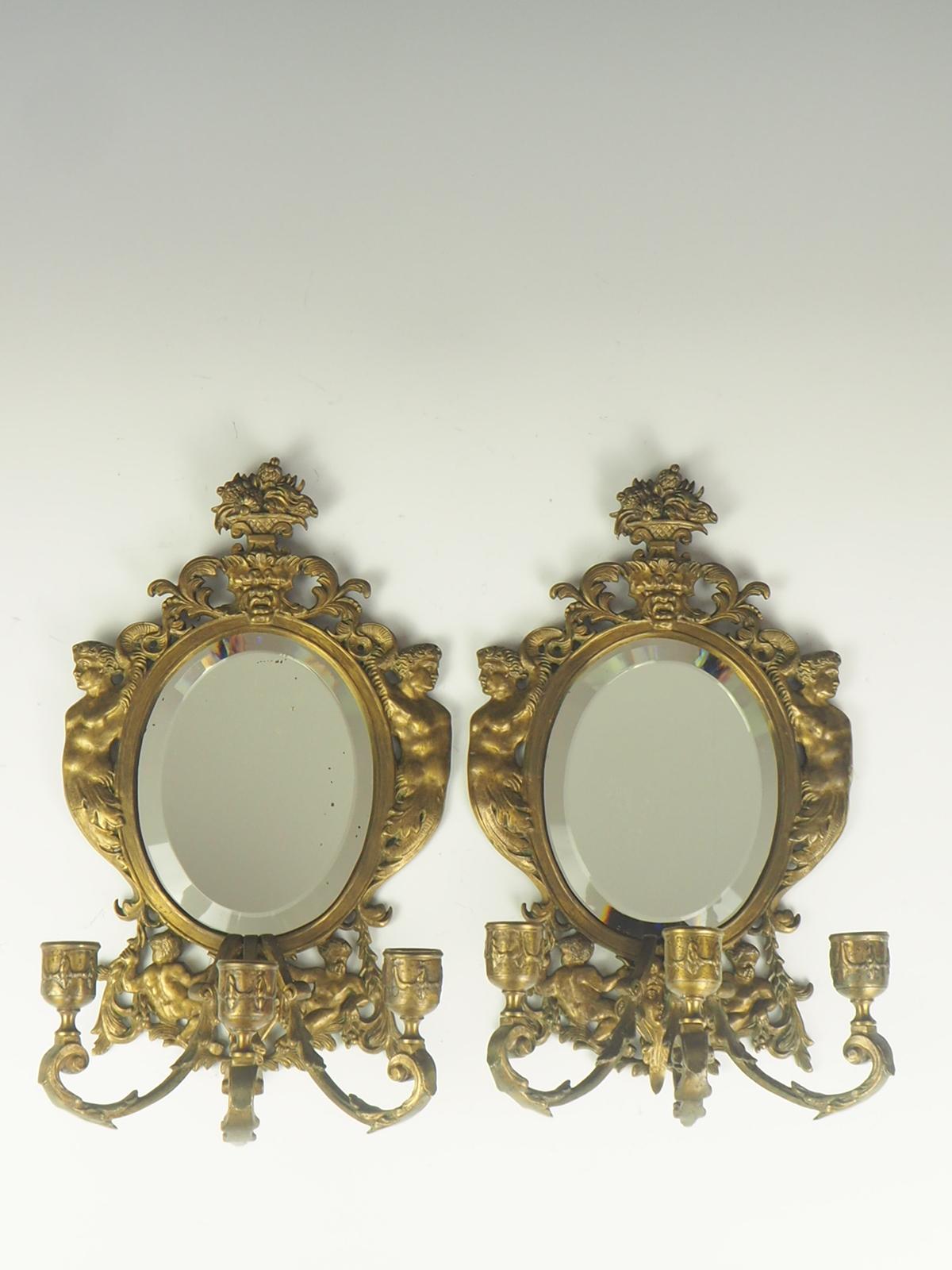 Pair of 19th century 'Girandole' Italian mirrored wall sconces

Very beautiful brass 19th century Italian mirrored wall sconces in original condition with three arm candles.

Bevelled mirrors

A girandole from French, in turn from