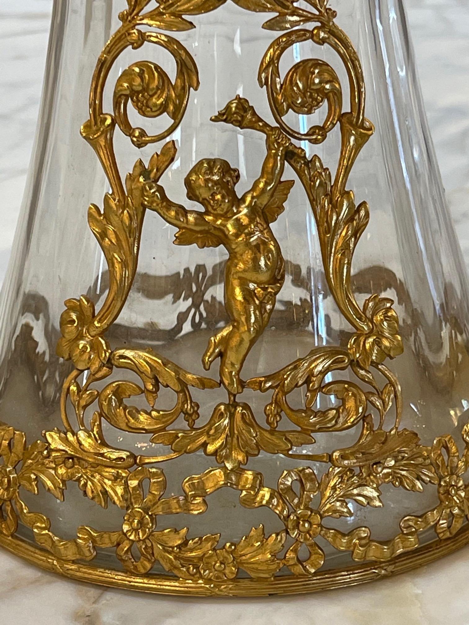 Exquisite pair of 19th century glass and Dore bronze vases. Gorgeous images of a cherub and floral images. Superb!!