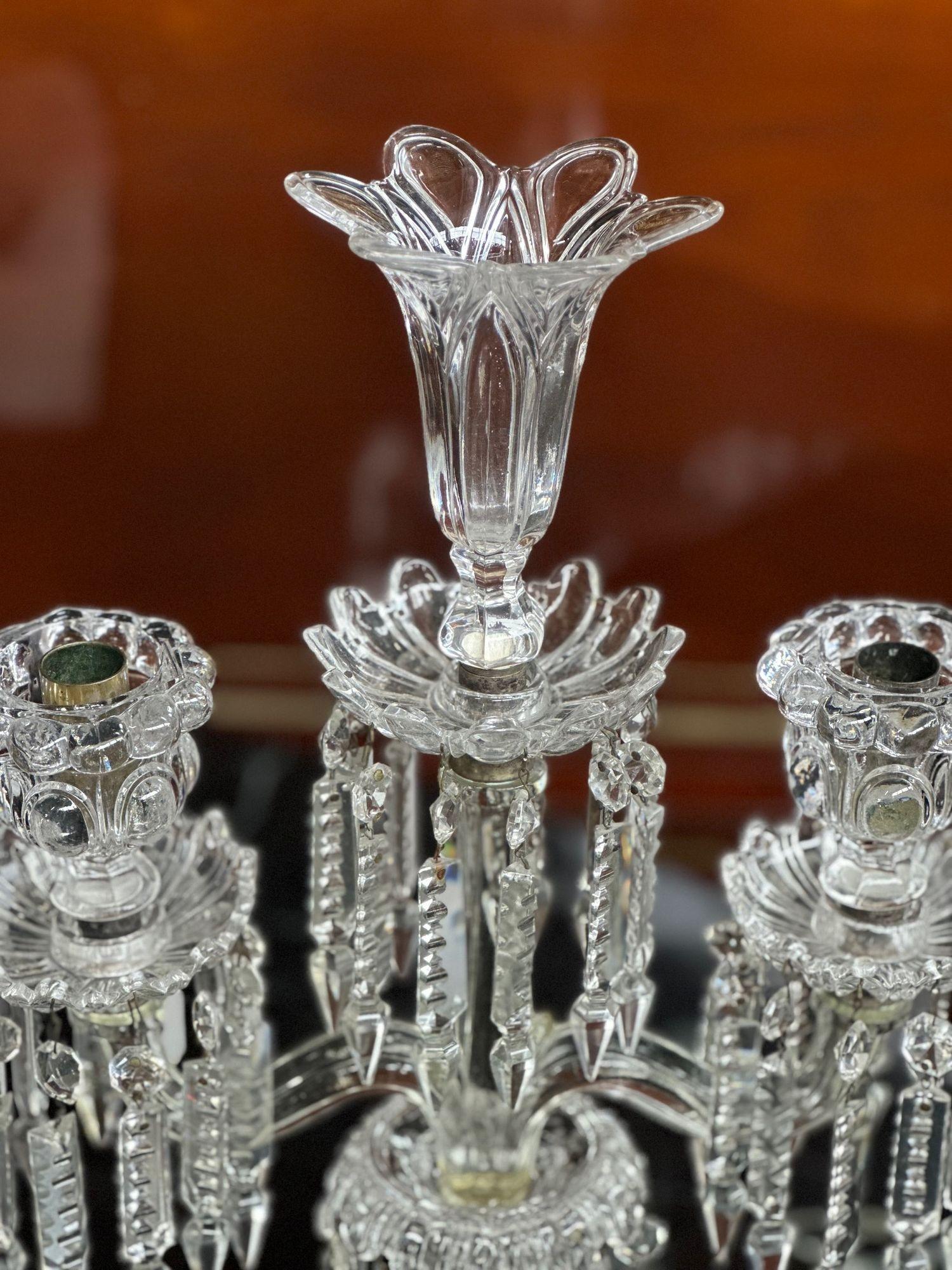 Pair of glass obelisk candelabras by Baccarat with scalloped bases. Made in France, late 19th century.
Dimensions:
23.5
