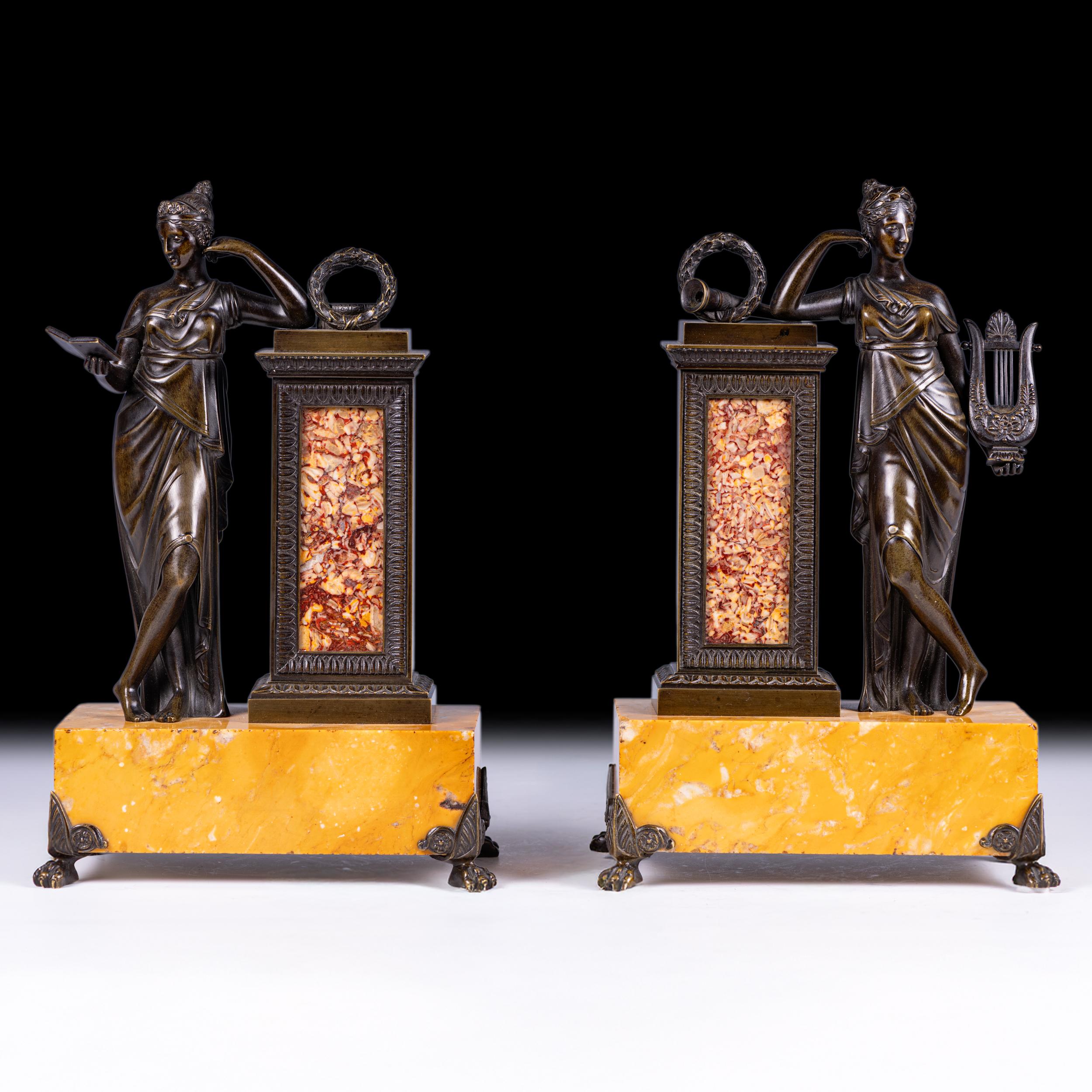 A Fine Pair of Grand Tour Bronze Classical Figures on Sienna Marble Bases with Spanish Brocatelle Marble Insets,
each finely cast and patinated bronze figure depicting a classically draped maiden — one holding a writing tablet, the other a lyre —