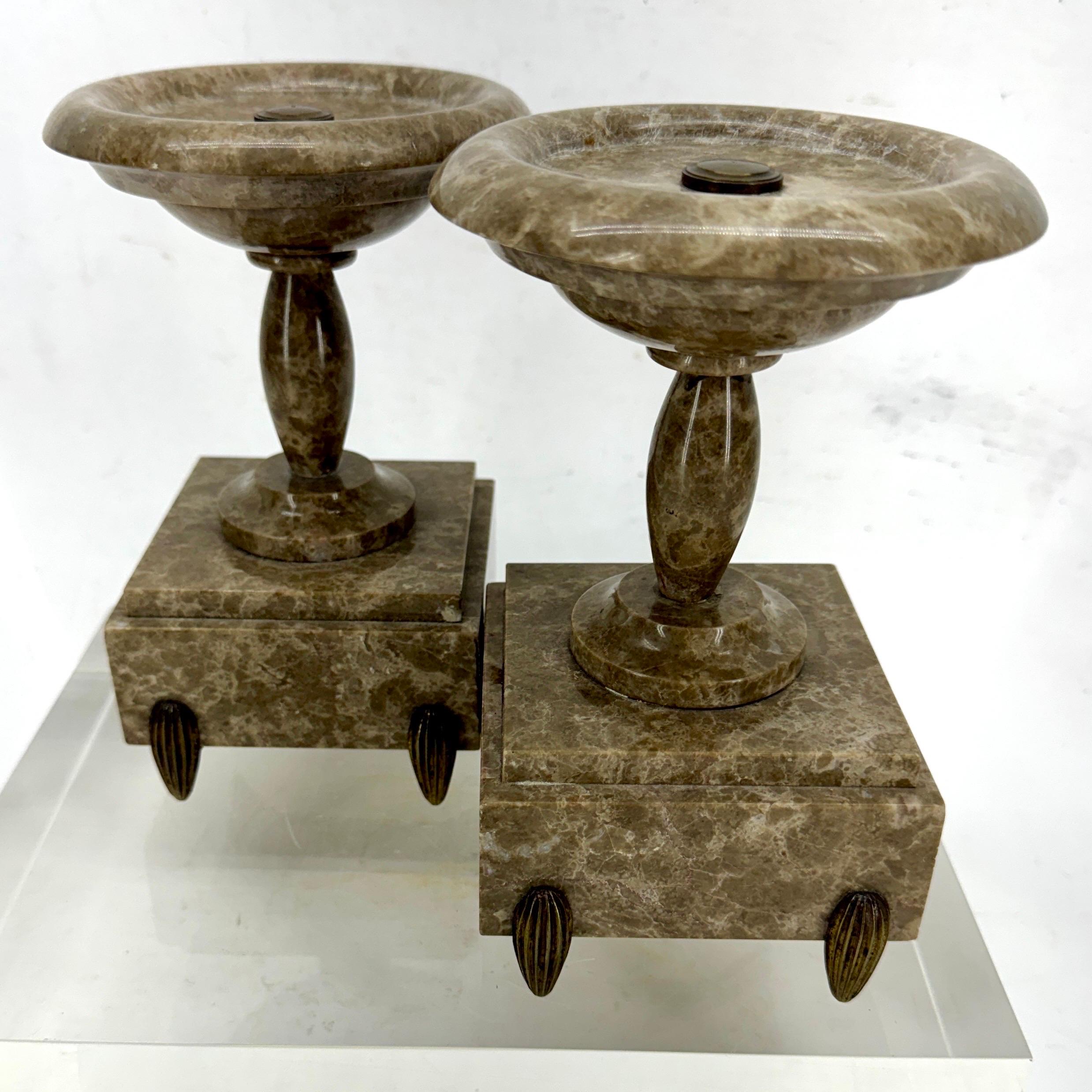 A pair of decorative Grand Tour marble tabletop tazza's. This pair has great detail including the tear drop style of Jacques Ruhlmann bronze feet. These could certainly be used for a unique display set on a mantle, coffee table but could also be