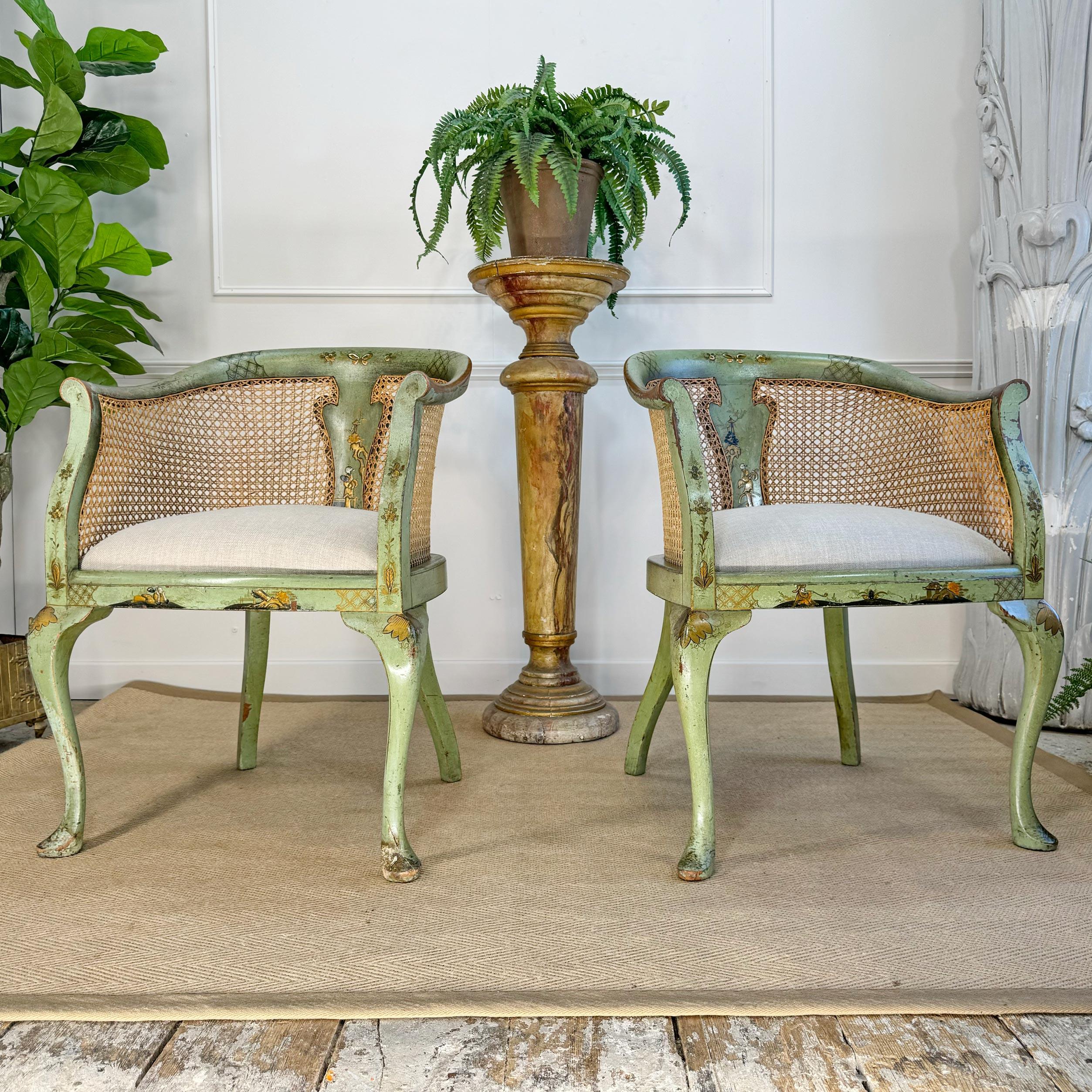 An outstanding pair of circa 1890 English, Queen Anne Revival bergère armchairs, in a glorious light green paint, with applied gilt chinoiserie decoration throughout. All canework has been professionally updated and is in excellent order.



The