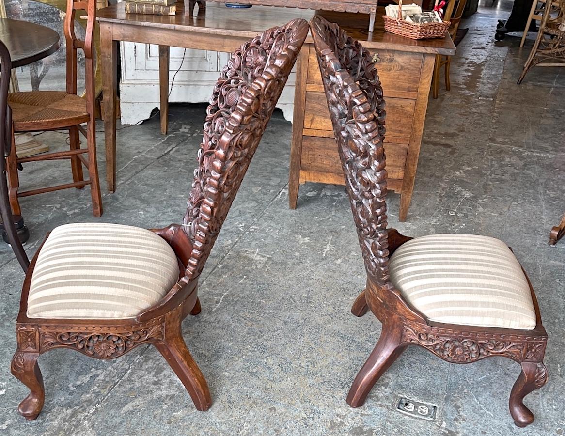 Hand-Carved Pair of 19th Century Hand Carved Burmese Nursing Chairs with Silk Covered Seats