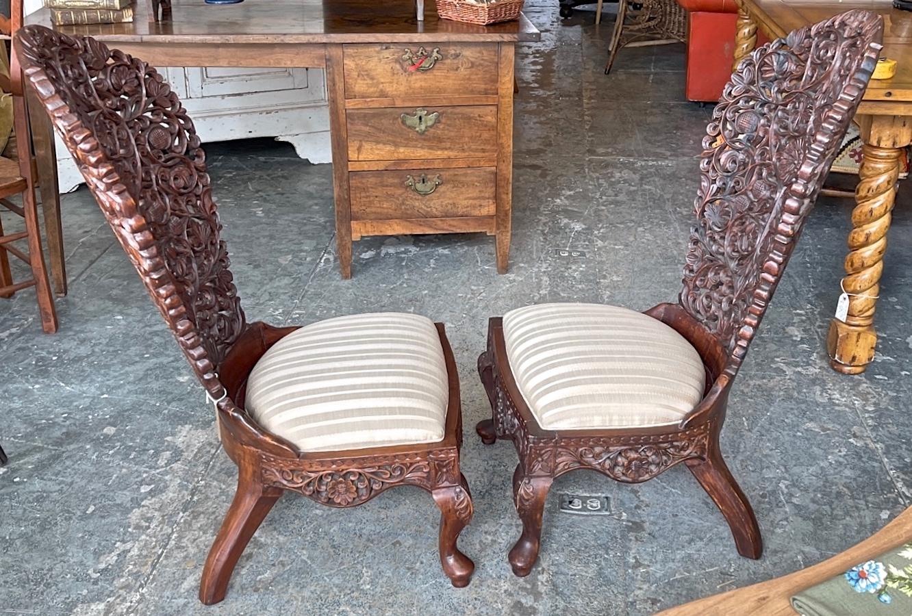 Pair of 19th Century Hand Carved Burmese Nursing Chairs with Silk Covered Seats In Good Condition In Santa Monica, CA