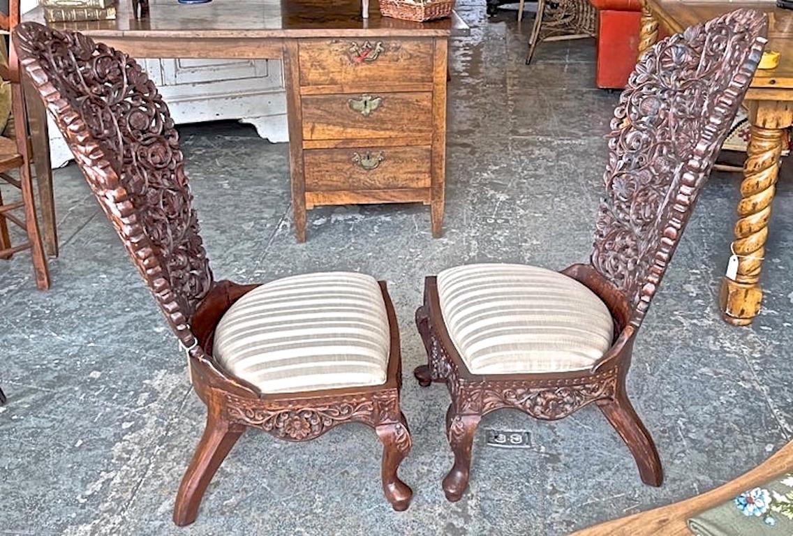 Pair of 19th Century Hand Carved Burmese Nursing Chairs with Silk Covered Seats In Good Condition For Sale In Santa Monica, CA