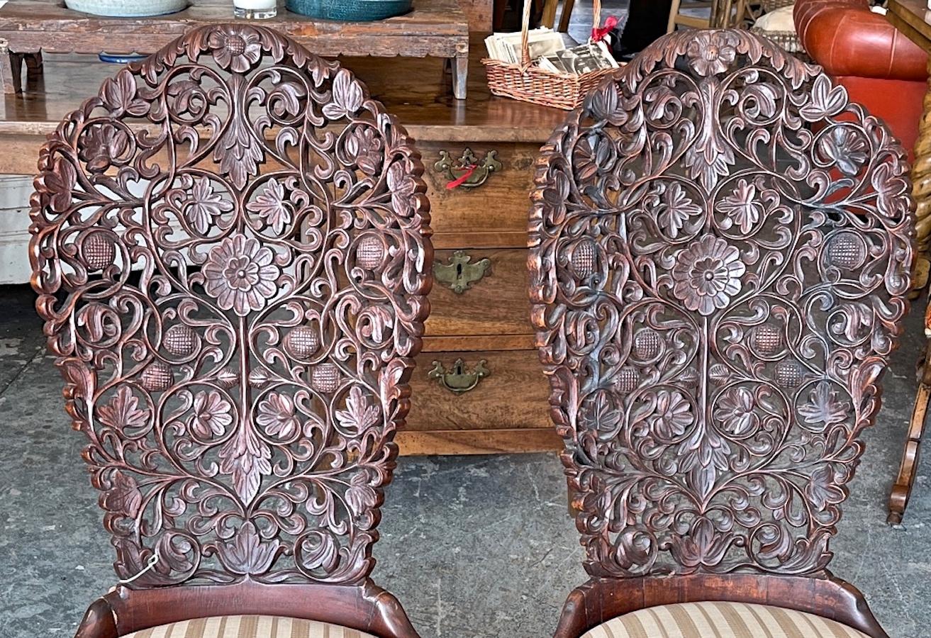 Pair of 19th Century Hand Carved Burmese Nursing Chairs with Silk Covered Seats 2
