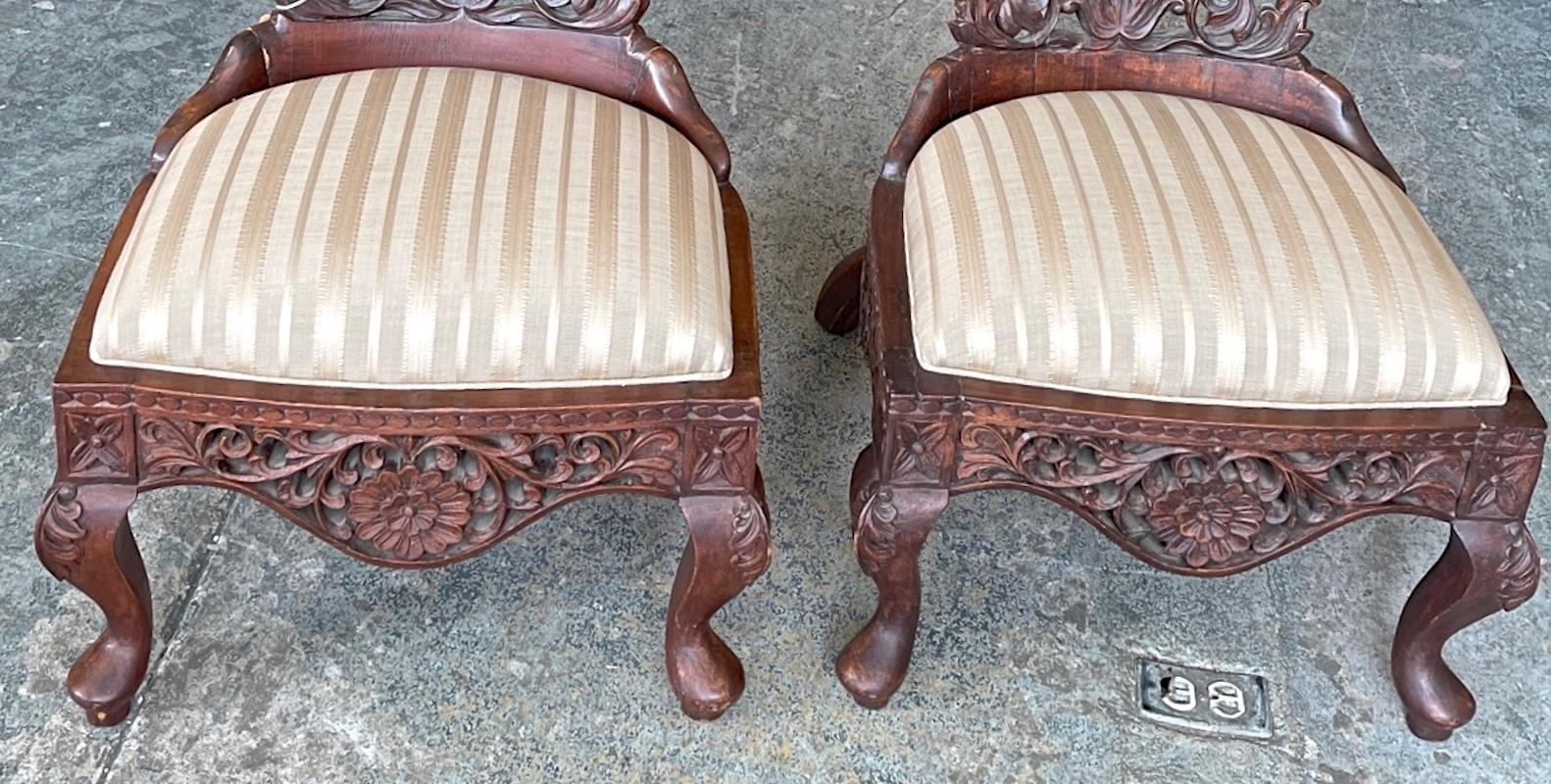Pair of 19th Century Hand Carved Burmese Nursing Chairs with Silk Covered Seats 4