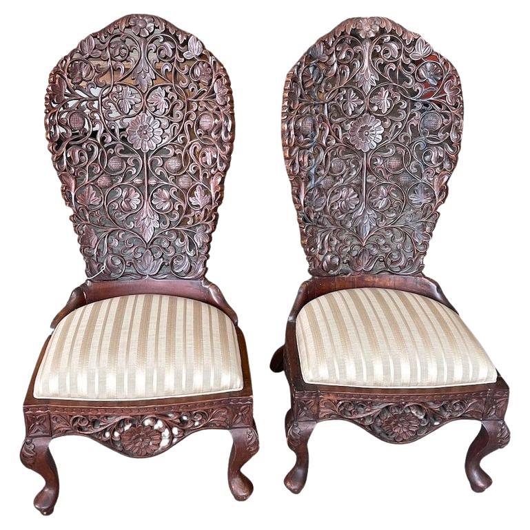 Pair of 19th Century Hand Carved Burmese Nursing Chairs with Silk Covered Seats For Sale
