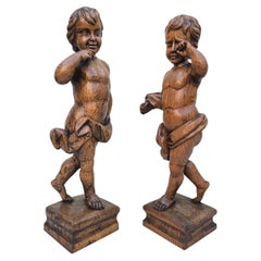 Pair of 19th Century Hand-Carved Oak Putti Figures Representing Joy and Sorrow