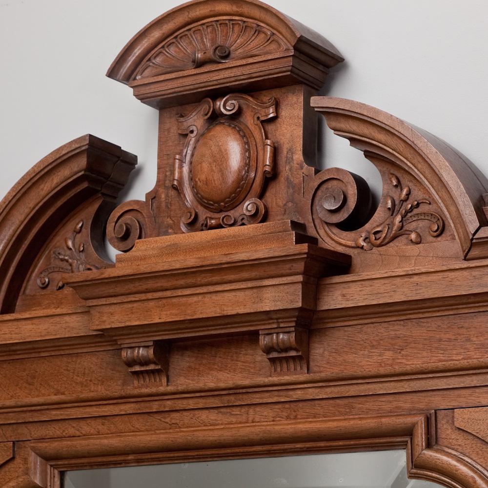 Pair of 19th century Irish neoclassical carved walnut mirrors with carved detail to the top edge.
   
 