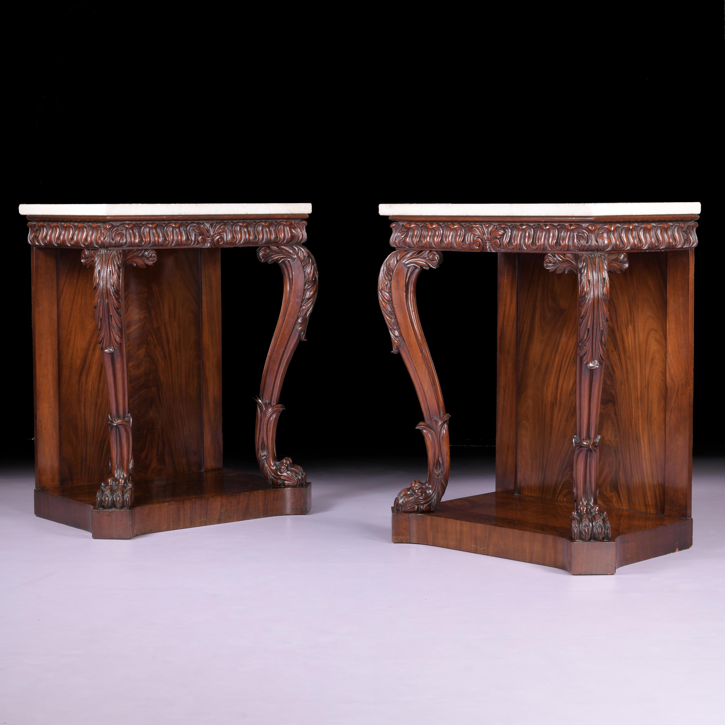 The rectangular white marble tops above lotus-leaf carved friezes, the cabriole supports with acanthus-carved knees and claw and ball feet, on rectangular plinths.

Circa 1820

Irish

Footnote:

The firm of Mack, Williams and Gibton were