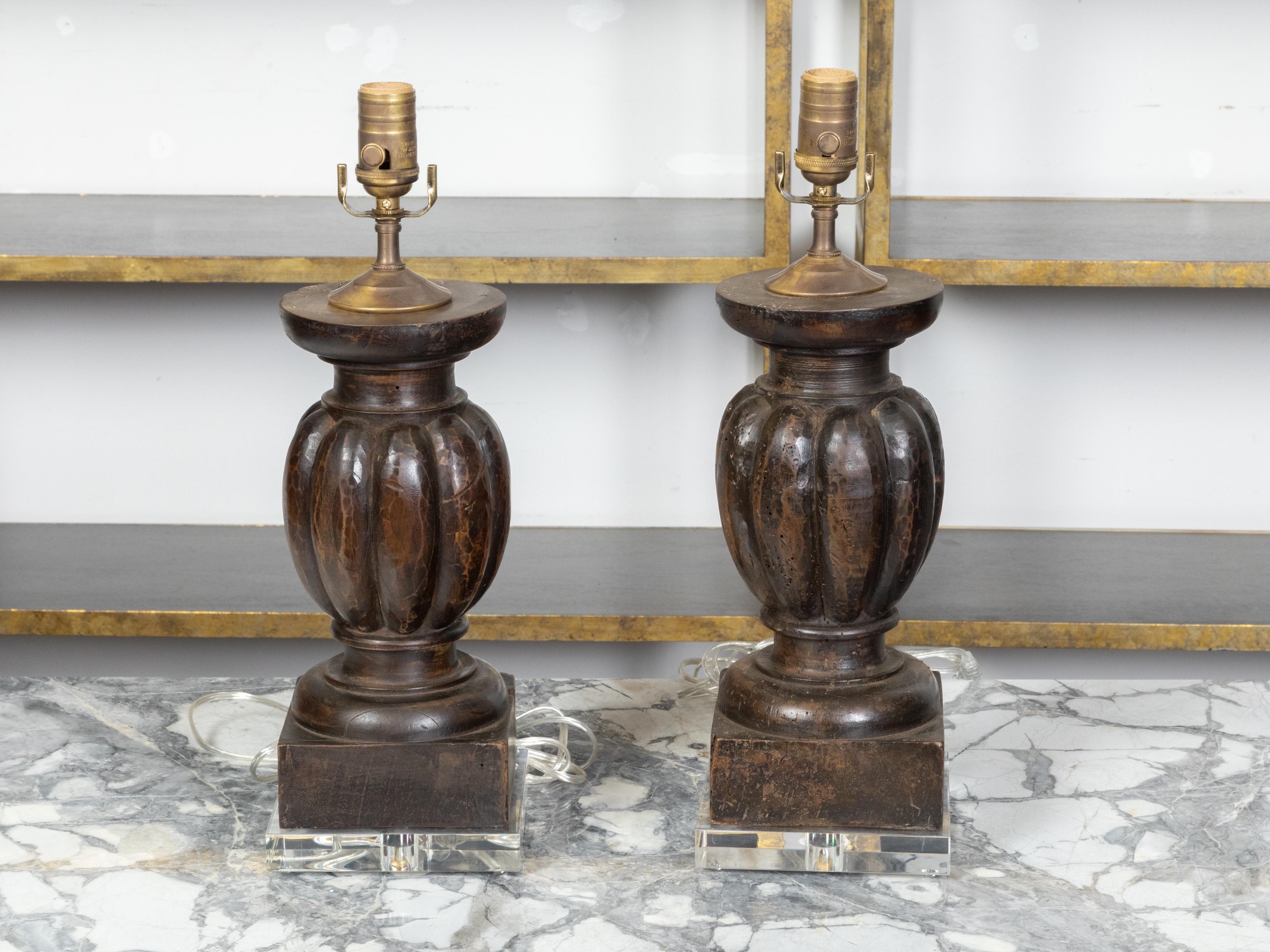 Carved Pair of 19th Century Italian Baluster Fragments Made into Wired Lamps on Lucite For Sale