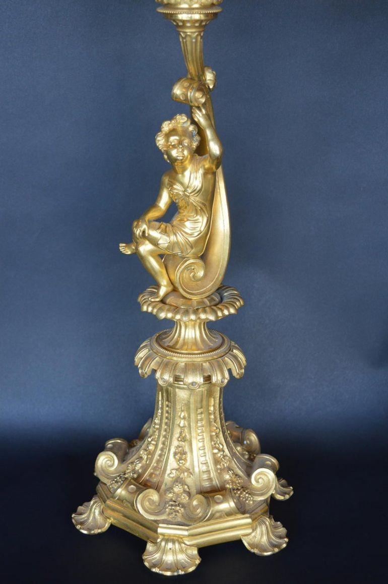Pair of bronze gold-plated candelabras.