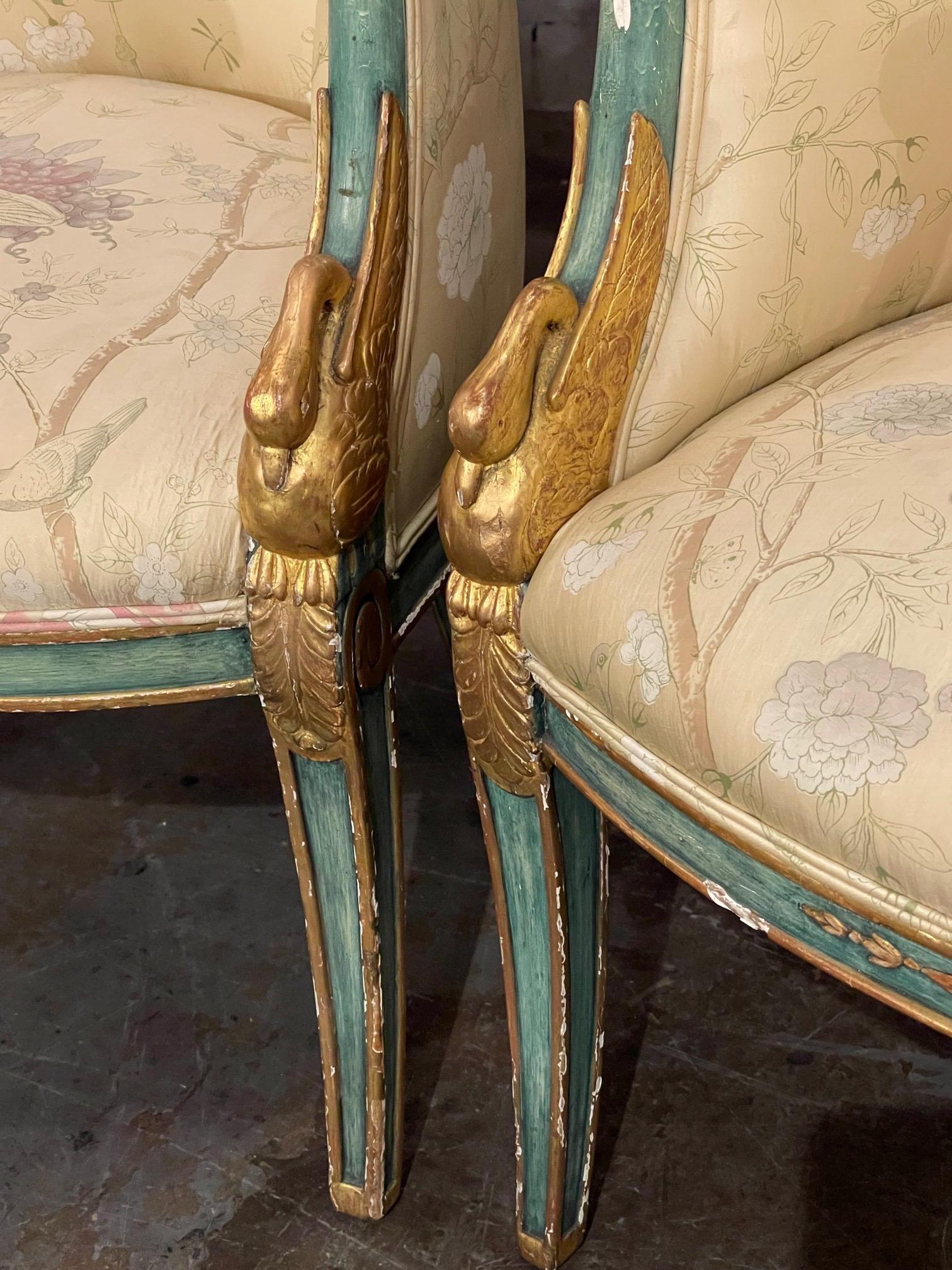 Gorgeous pair of 19th century Italian carved and parcel gilt Empire style Bergeres. Nicely carved with colors of green and gold gilt. And upholstered in a beautiful floral fabric. Very special!!