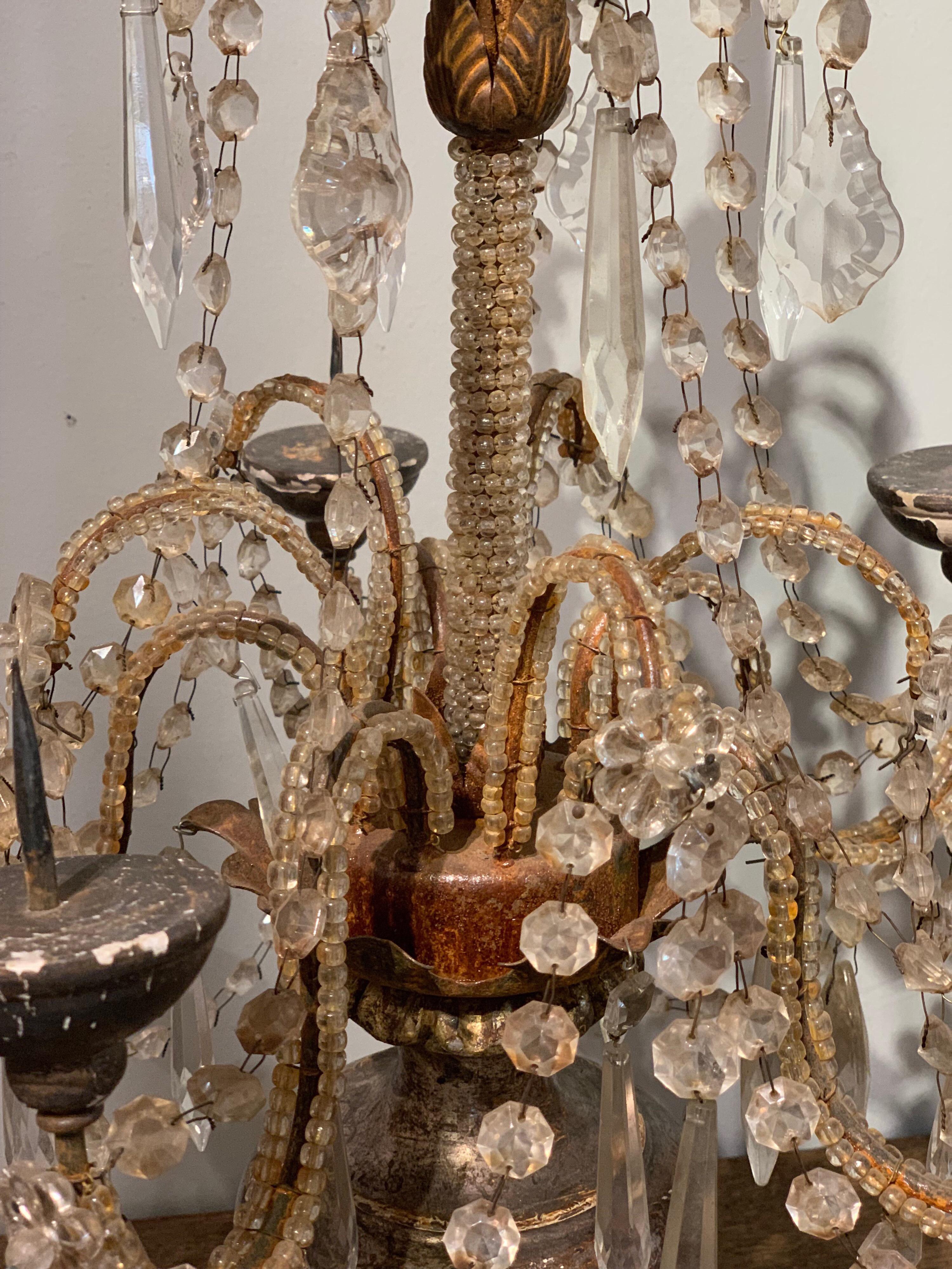 Beautiful pair of silver gilt beaded candelabras. The center and arms are beaded and there are lovely dangling crystal beads and prisms. Very nice silver gilt on the piece as well.