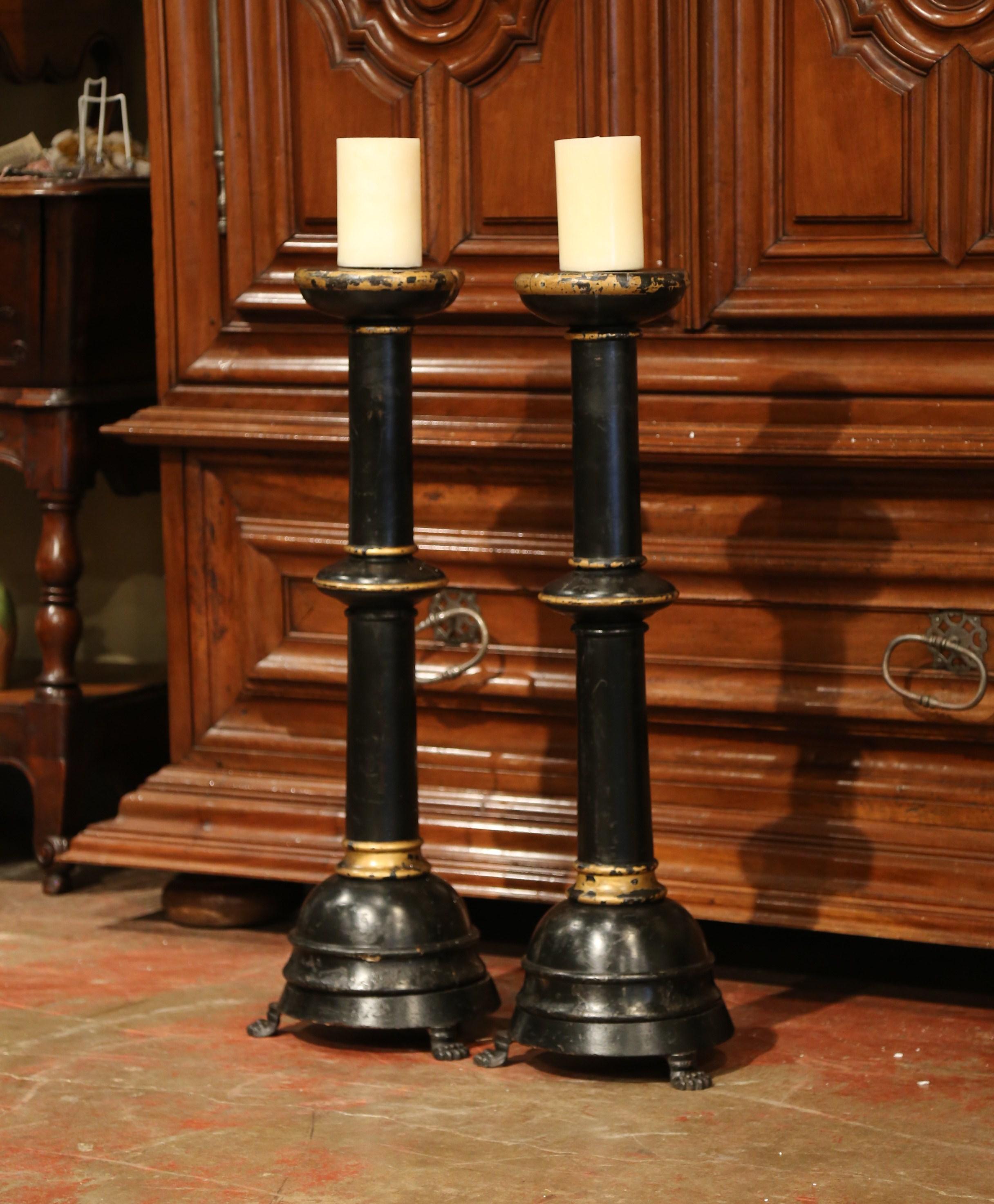 Decorate your mantel or entry console with these important antique altar sticks. Crafted in Italy, circa 1860, each tall candlestick stands on three hand carved paw feet and features a turned stem and wooden pricket at the top to hold a candle. Both
