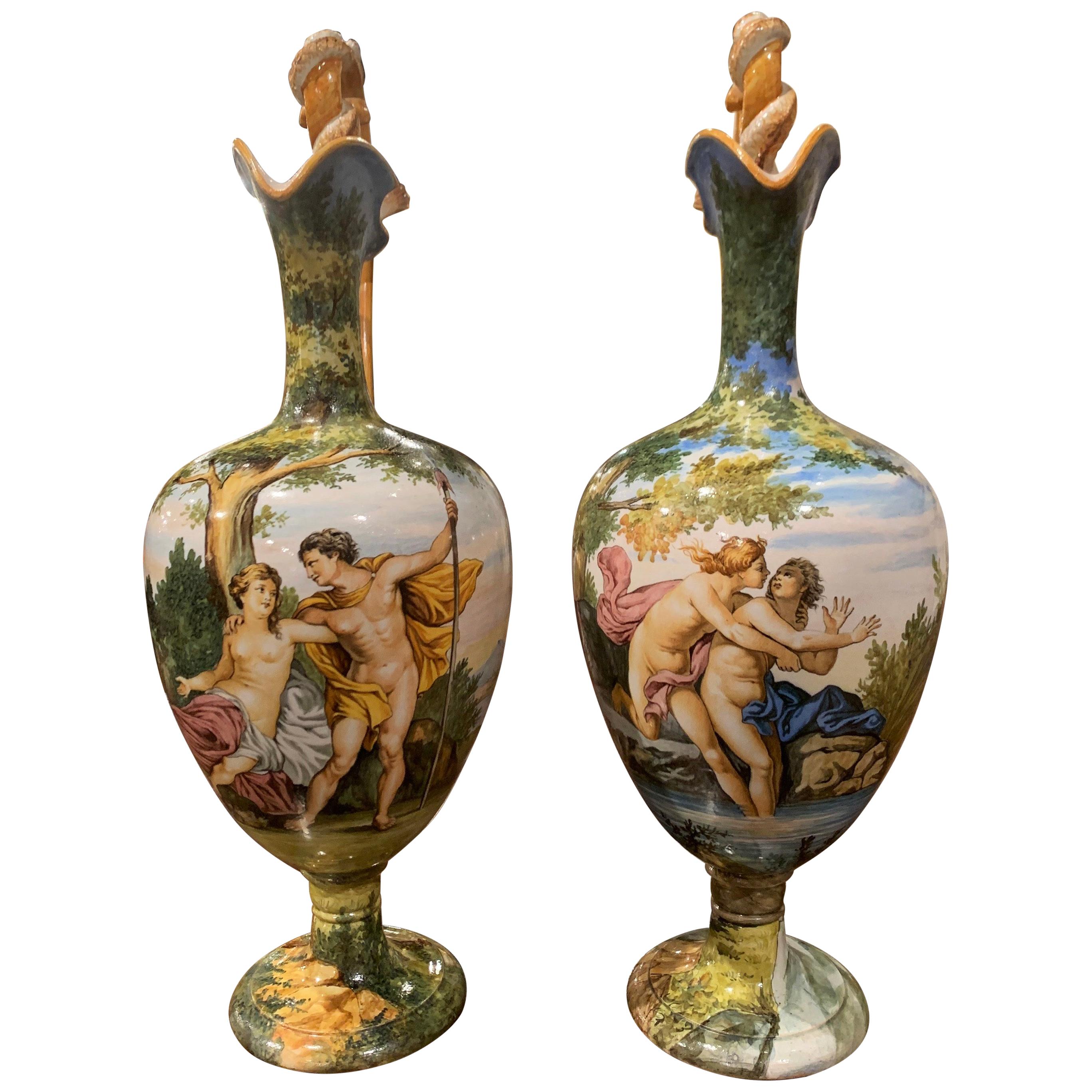 Make a statement on a mantel or enfilade with this pair of sculptural, antique Venetian vases. Sculpted in Venice, Italy circa 1890, the artful, ceramic vases have a unique shape with wide mouth and detailed illustrations; each vessel has a