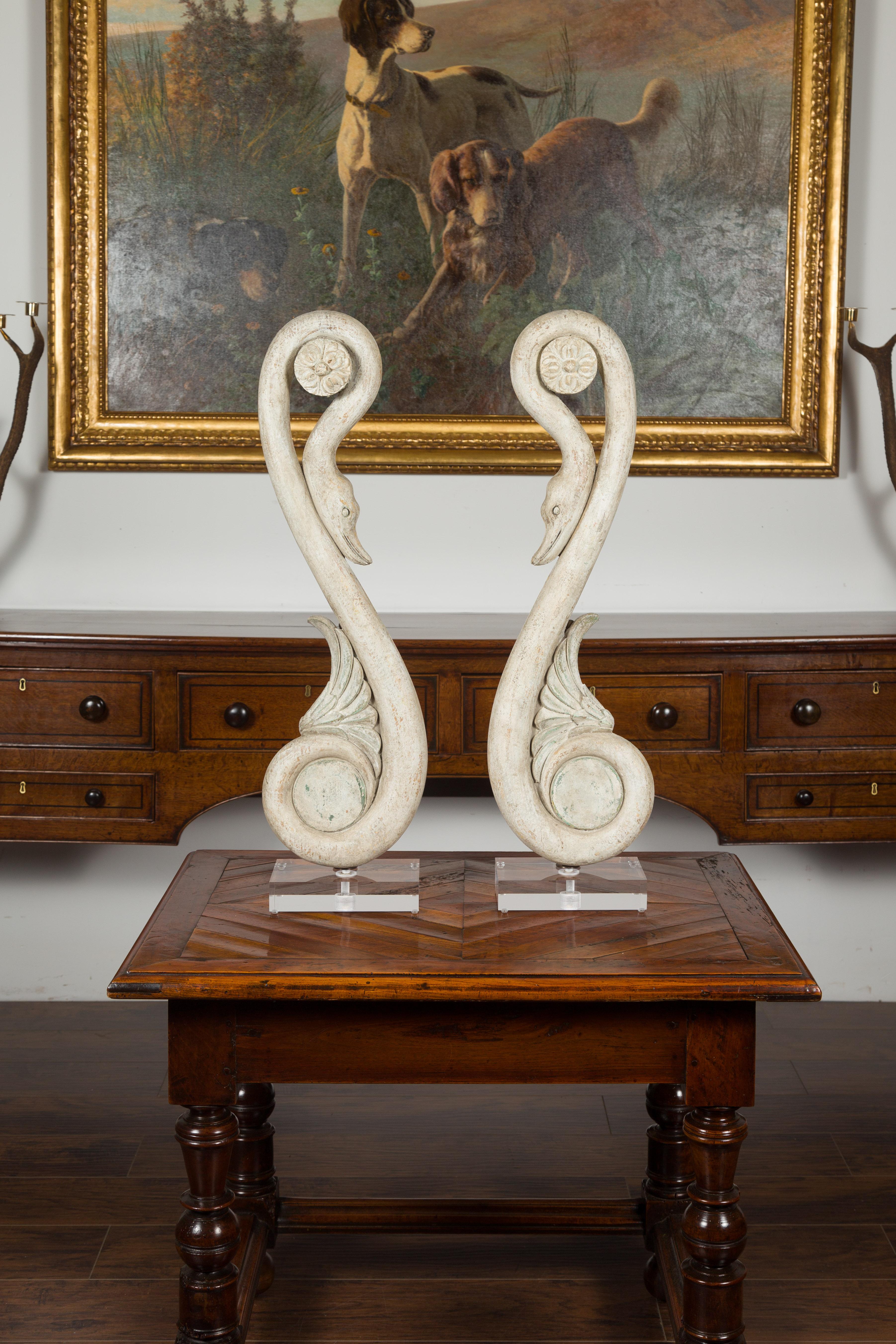 A pair of carved Italian swan fragments from the 19th century, mounted on custom Lucite bases. We have two pairs available, priced and sold $3,995 each pair. Created in Italy during the 19th century, each of this pair of carved fragments features a