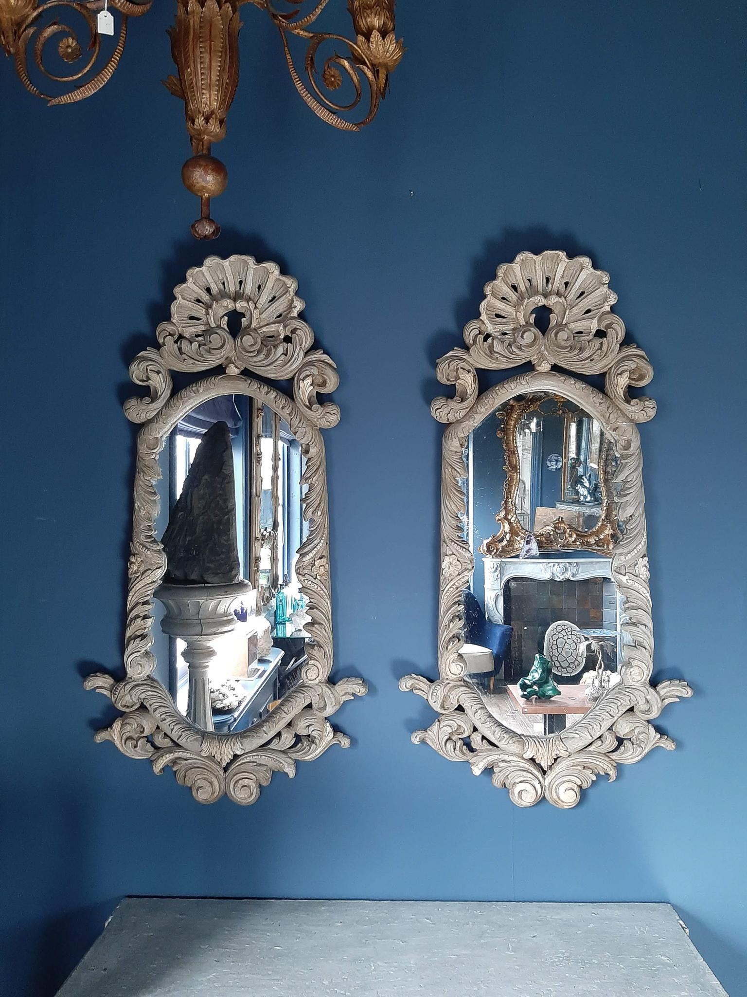 Pair of antique 19th century Italian carved pine wood mirrors with a light greenish gray 'ver de gris' patina.

Measures: Height 120 cm x Width 62 cm.