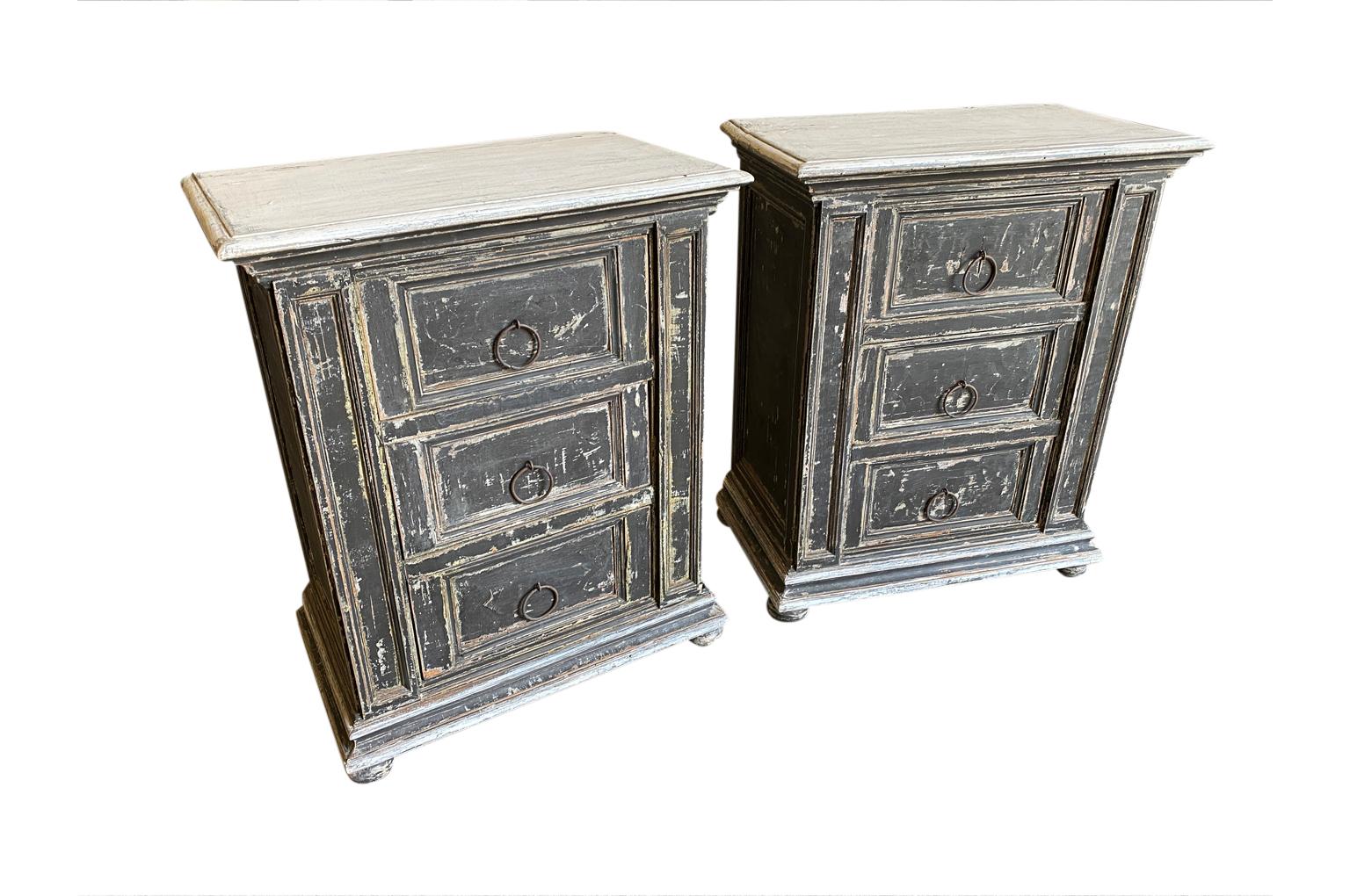 A very charming pair of late 19th century Italian comodini in painted wood with 3 drawers resting on bun feet. Perfect bedside side cabinets.