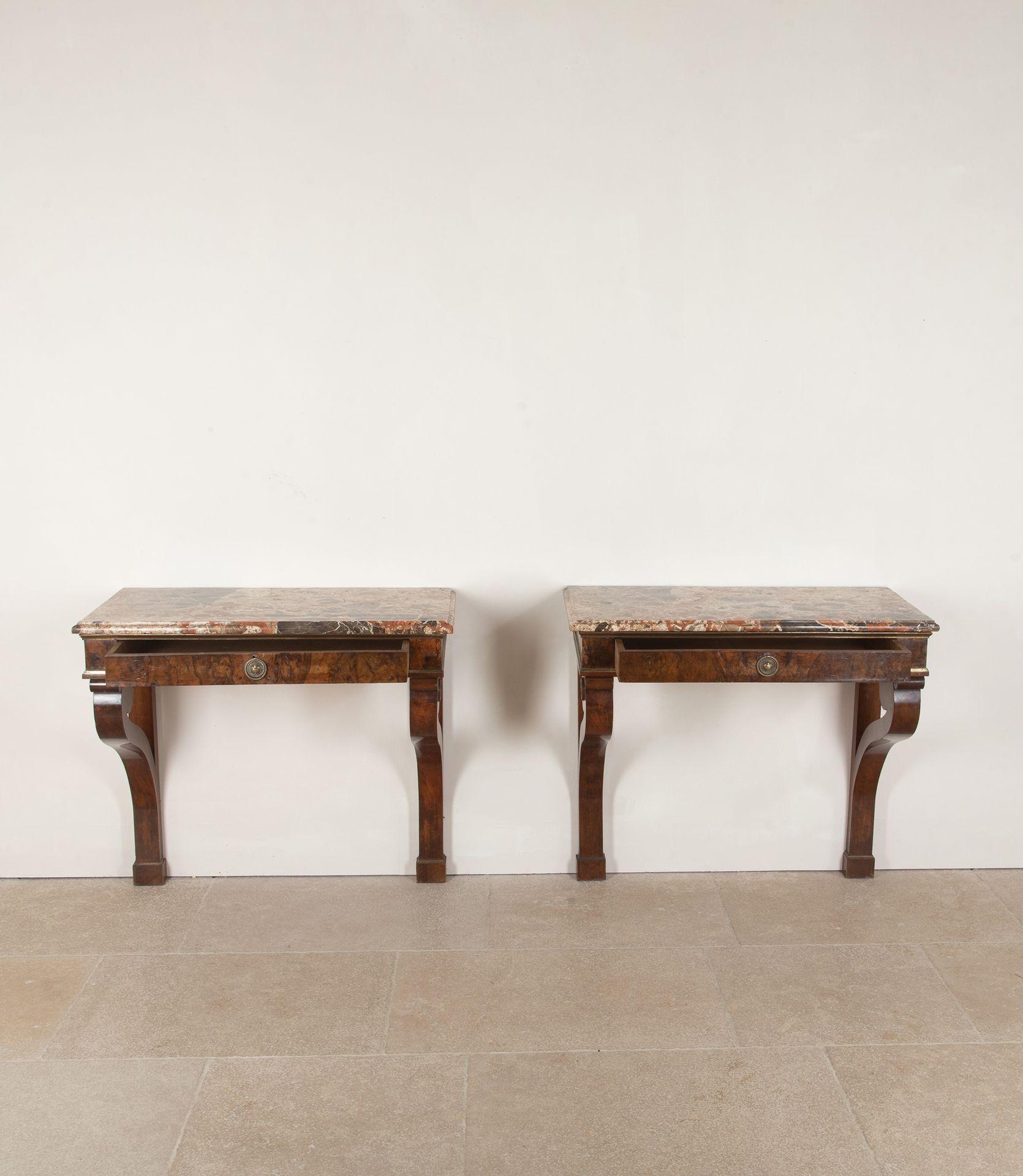 A fine pair of early 19th Century Italian Empire walnut console tables, Lombardy. With very good Breche d'Alep moulded rectangular tops above a single drawer with brass moulding supported by swept back curved legs, each side topped with a bronze