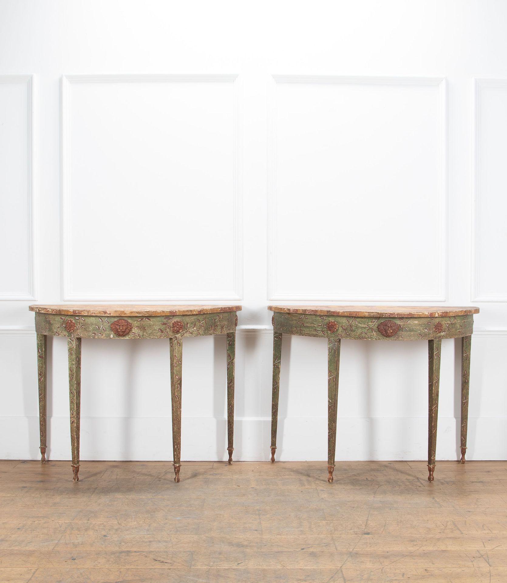 An extraordinary pair of late 19th Century Italian original hand painted demi-lune tables. 
Beautifully decorated with faux painted tiger top above elegant tapered legs. 
Stunning lion mask detailing. 