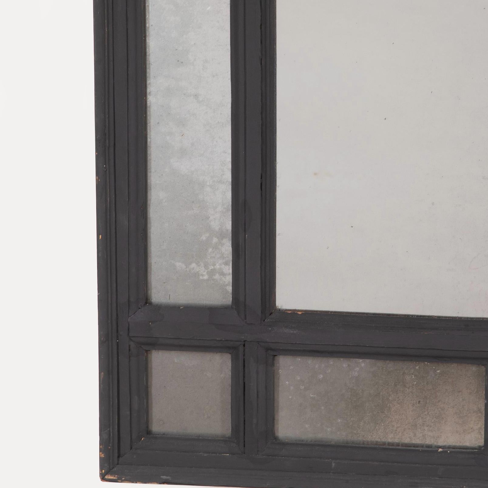 A stylish pair of Italian mid-C19th sectional ebonised mirrors. 

The rectangular mercury plates surrounded with a border of mirrored panels within a plain moulding. Decoration refreshed. 

Age-related minor scuffs, scratches and scrapes.